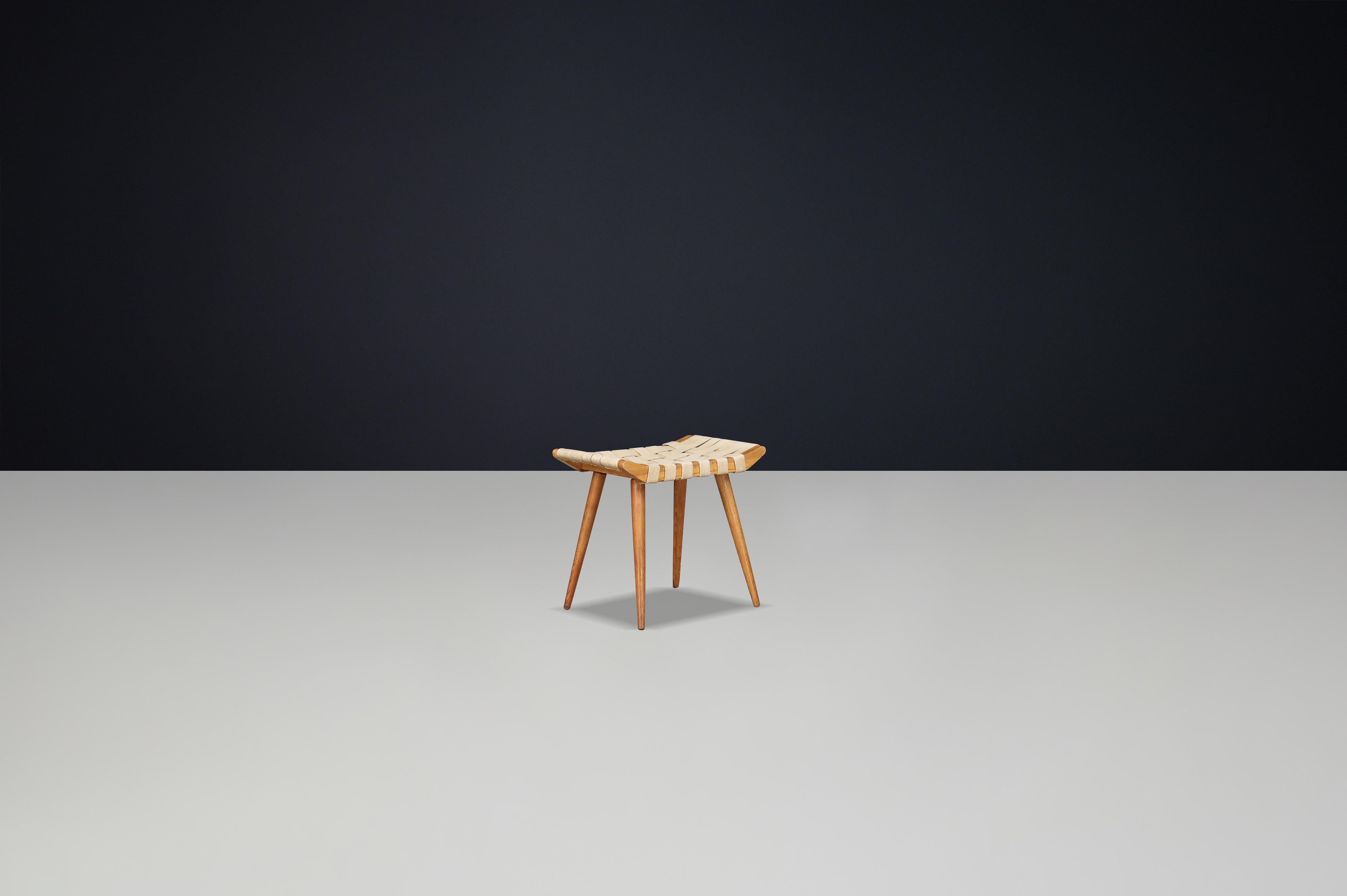 French Mid-Century Ash Stool with Original Canvas Webbing, 1950s — 3 Available

A refined example of French mid-century craftsmanship, this ash stool from the 1950s pairs minimalism with artisanal charm. Made from solid ash wood and retaining its