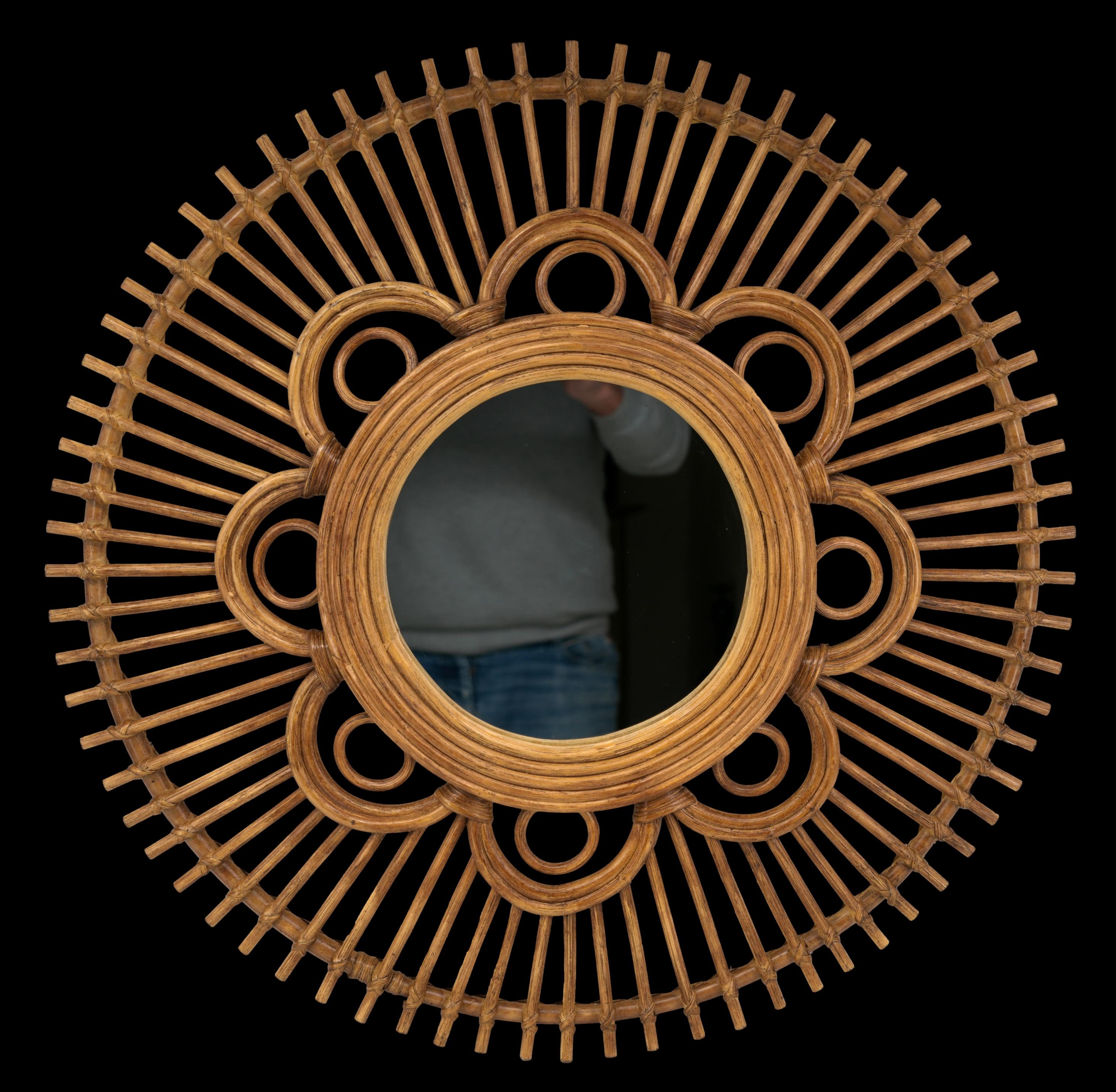 French Mid-century wall mirror, France, 1950s. Bamboo and rattan mirror with radiating floral decoration. Diameter: 25.6