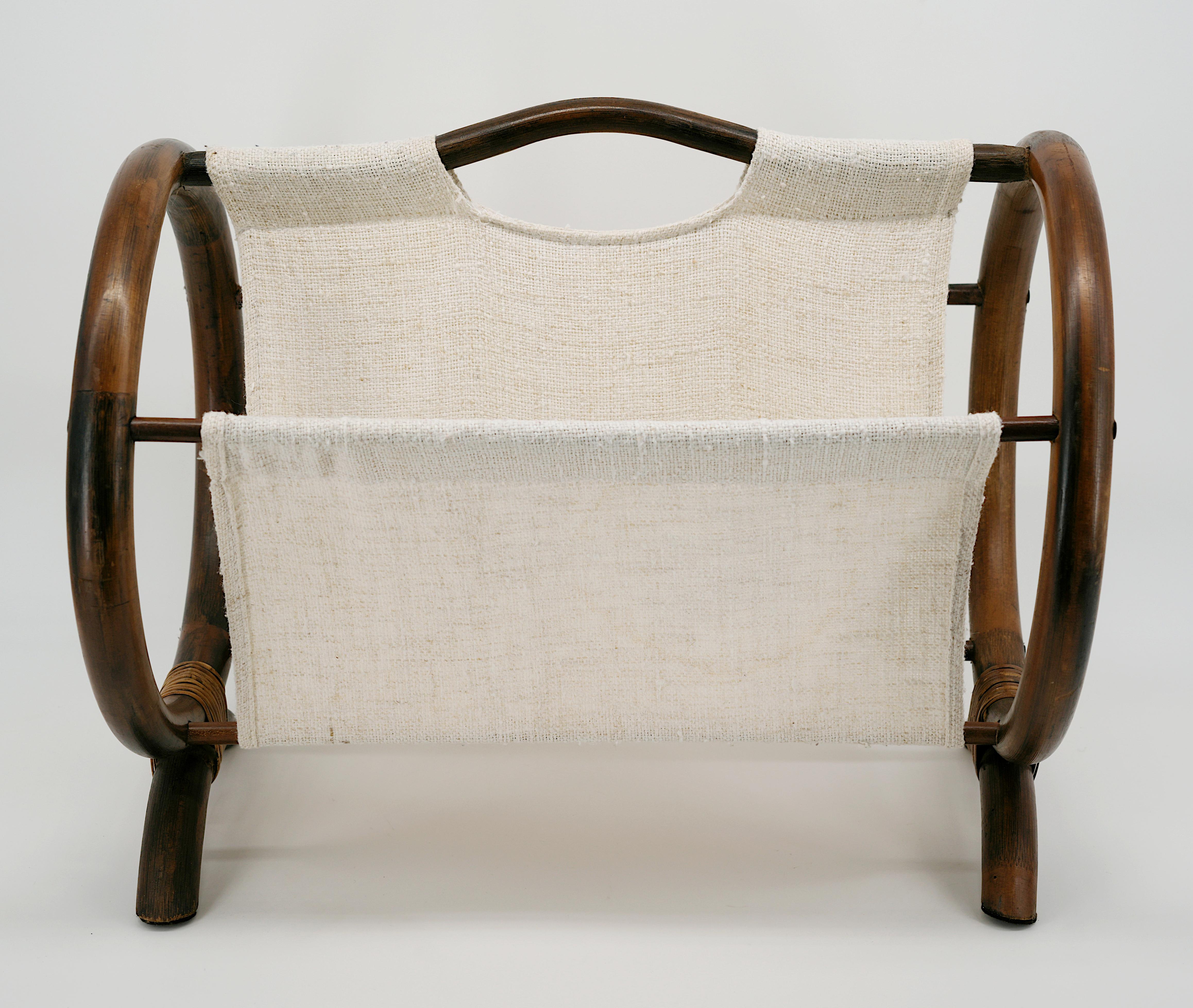 French Mid-Century Bamboo and Rattan Magazine Rack, France, 1960s. 

Materials: Bamboo, Rattan & Fabric
Dimensions:
Height: 14.8