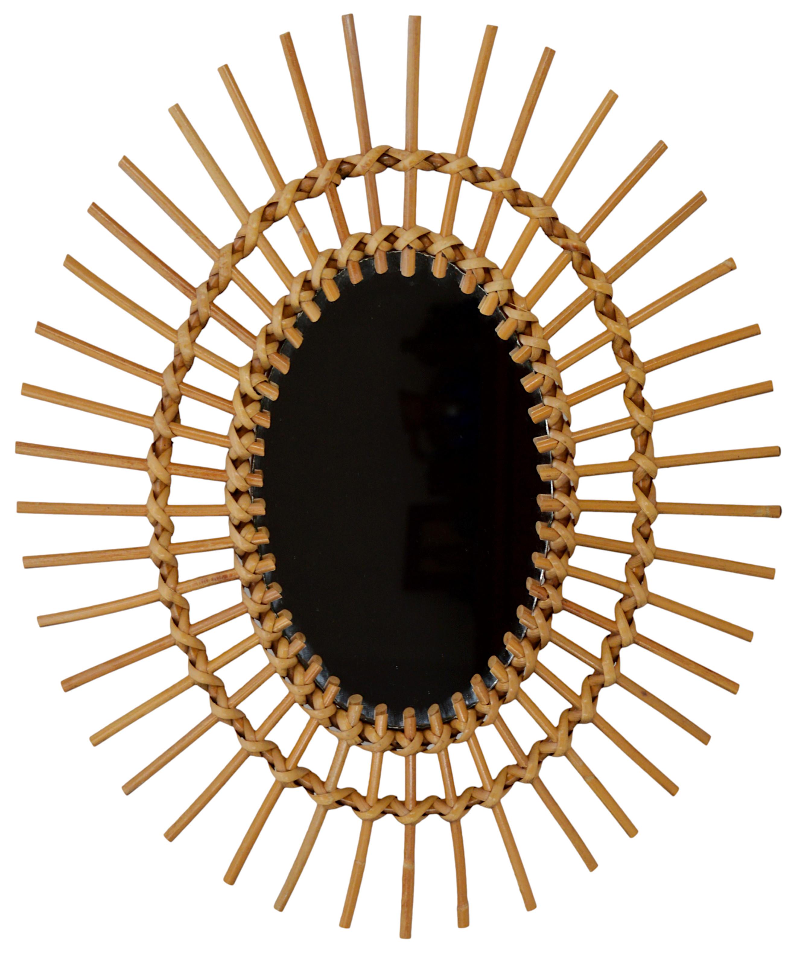 French mid-century wall mirror, France. Genuine from the 1950s. Bamboo and rattan mirror with radiating decoration. Original mirror in very good condition. Measures: Height: 22.8