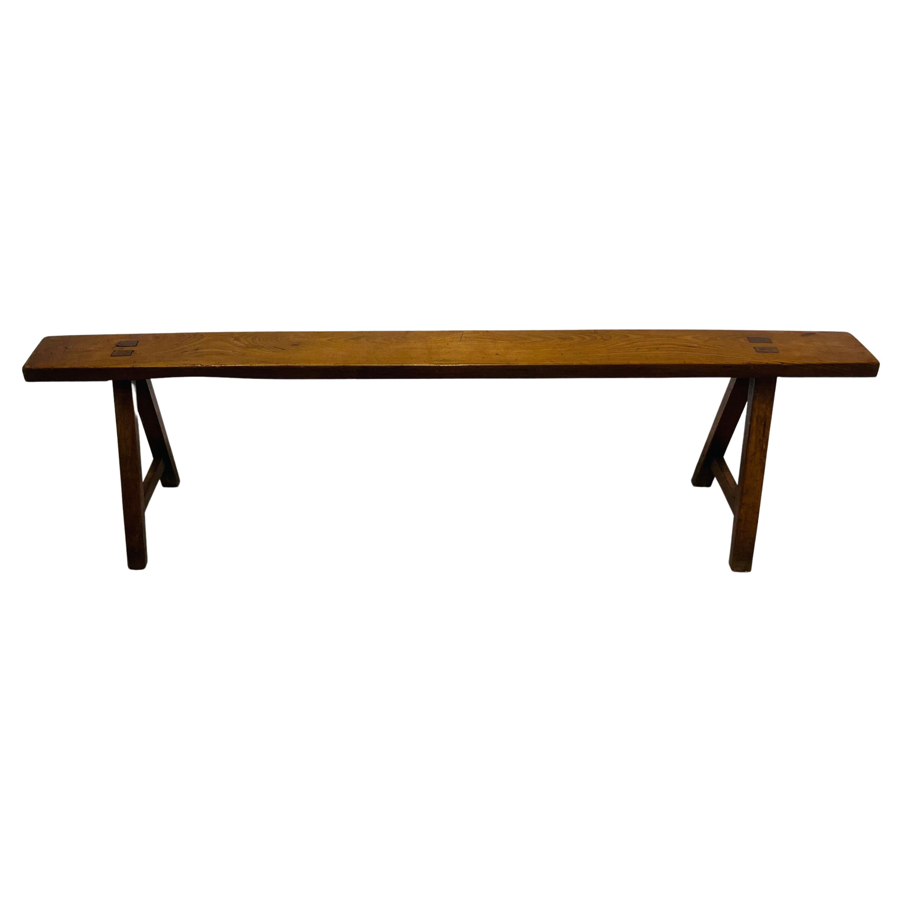 Wooden bench hand made in France in the 1950s, a minimalist line gives a powerful character to this functional decorative element.