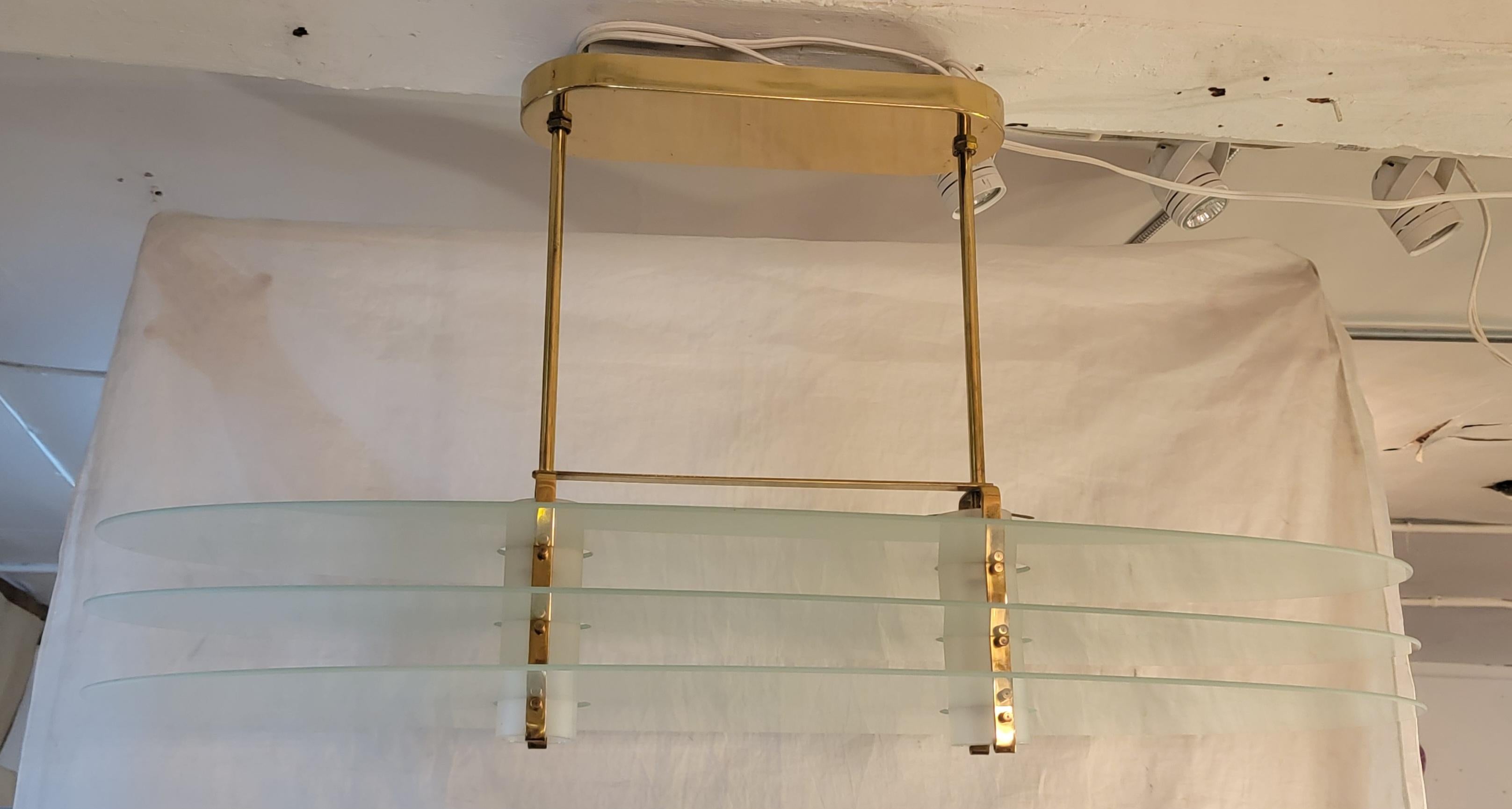 French Mid Century Brass and Glass Three tier Chandelier. The three glass pieces are held up by knob screws ( four each glass) as shown in images. Each glass piece comes off for easier transport and safety of all pieces.  Measures approx - 39w x 16