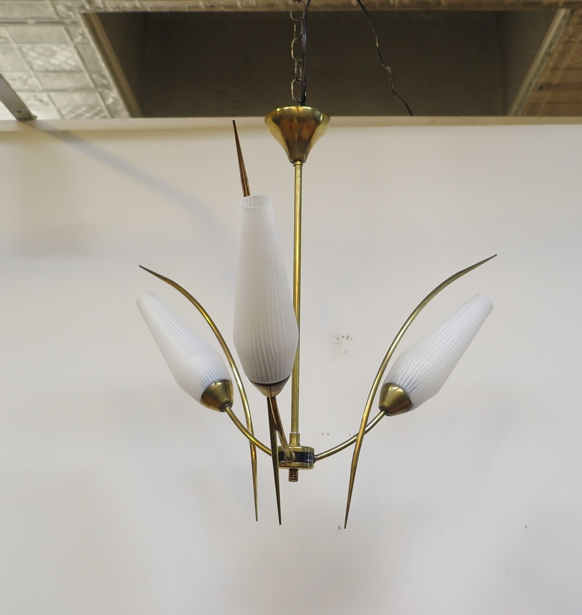 French Mid Century Brass Chandelier by Maison Arlus. Elegant brass arms with hand blown opaline glass shade diffusers. The glass shades have a striated effect in the glass consisting of white opaline glass lines and frosted glass lines in parallel