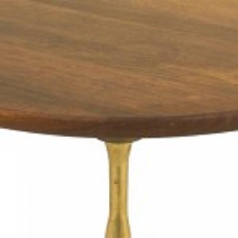 Tavolino rotondo francese del Mid-Century con piano in palissandro e tre gambe in ottone in finto bambù.

Condizioni vintage