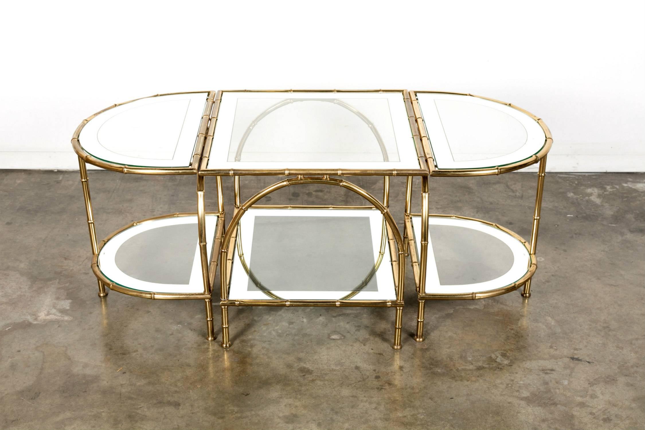 Stunning midcentury faux bamboo brass cocktail or coffee table by renowned French design house Maison Baguès composed of a central table with two demilune side tables that can separate and be used according to size and application as needed. All