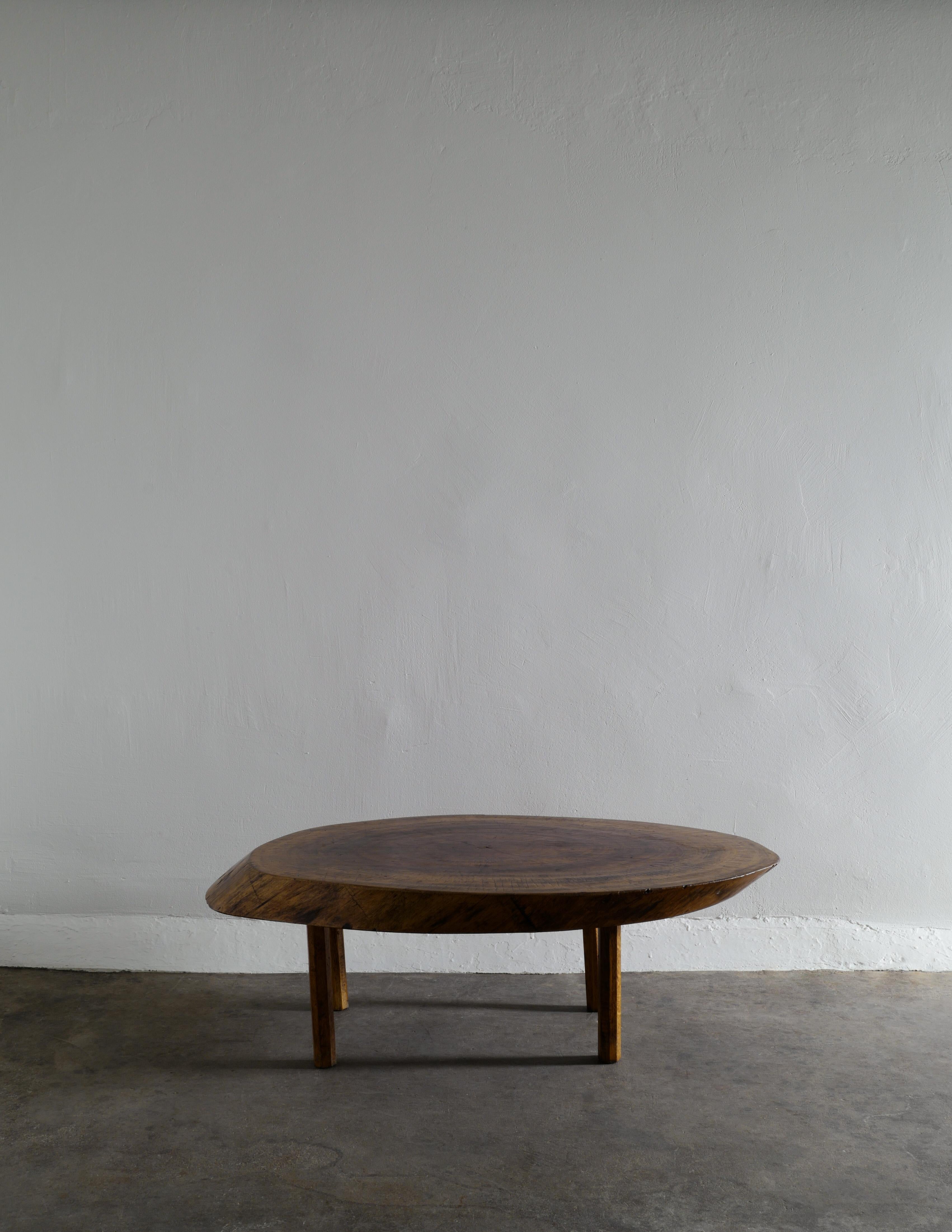 Rare French mid-centery free form brutalist table in solid most likely elm wood produced by unknown designer in the 1950s. The table top is produced in a single piece and have aged very beautifully. In good vintage condition with small signs from