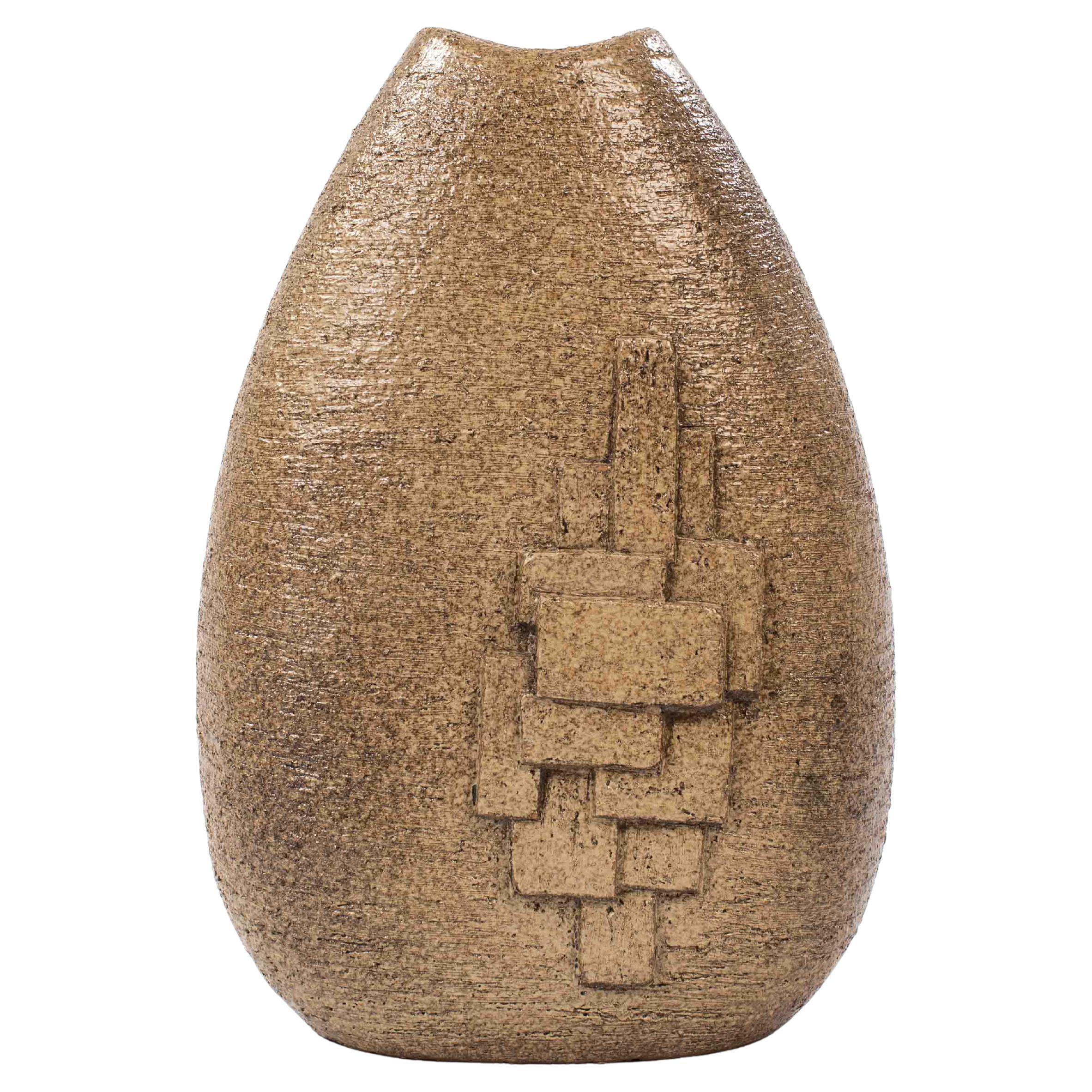 French mid-century ceramic vase with geometric decoration by Gabriel Masarra, 1950s
The shape is conical and narrows towards the top (7-19cm)
The opening is slightly curved, the inside of the vase is spelt brown.
The surface is rough and textured