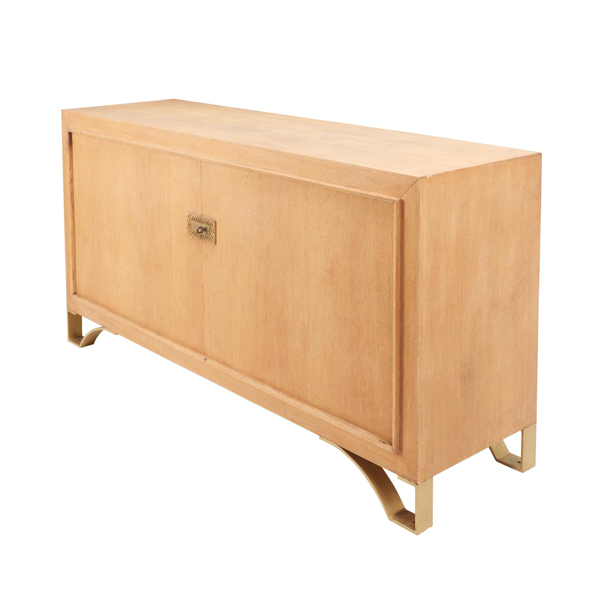 This midcentury rectangular buffet sits atop an elegant brass base. The keyplate adds a beautifully subtle detail to this simple yet stunning statement piece made of oak in the stylish French Cerused finish.

Since Schumacher was founded in 1889,