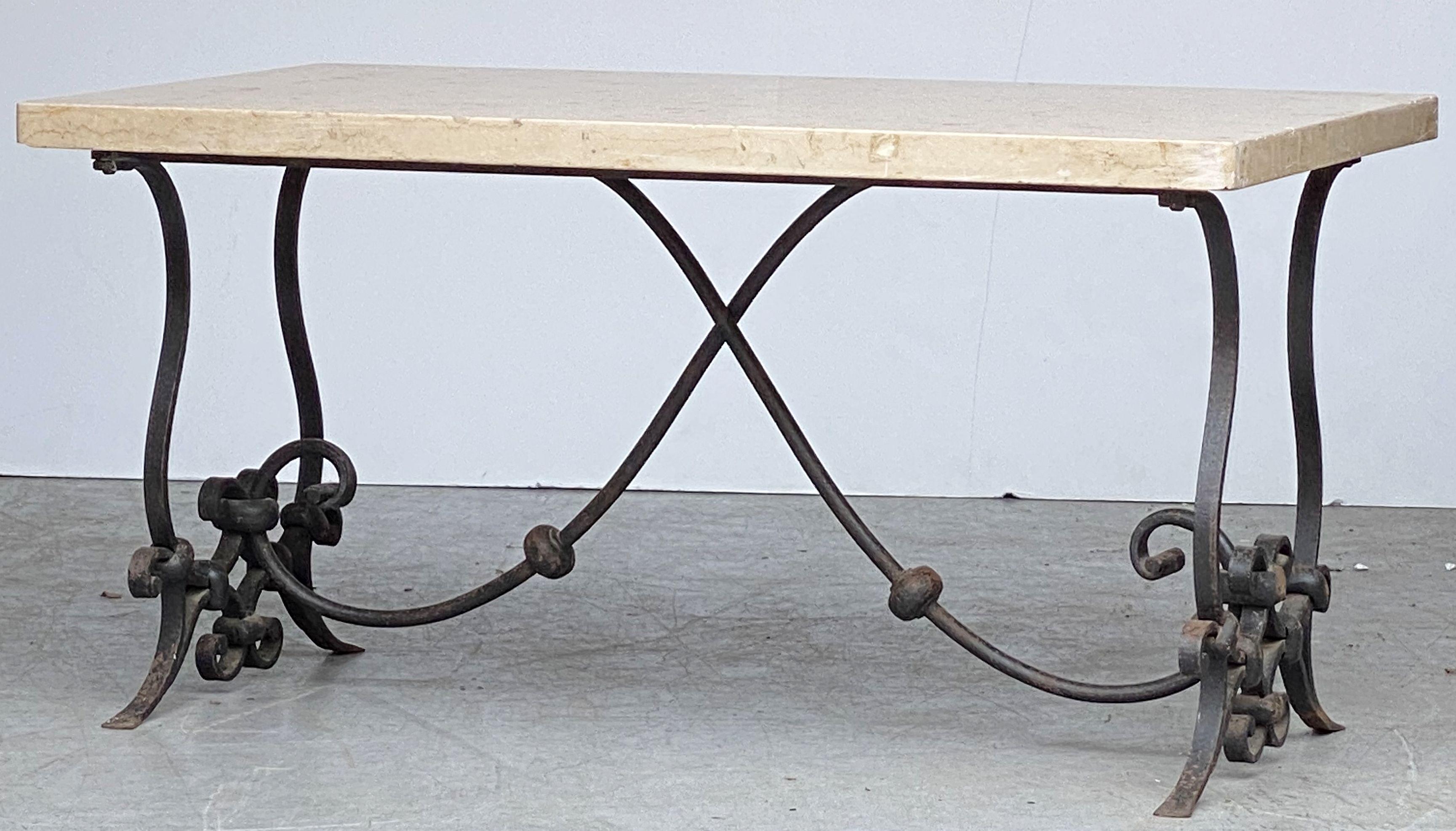 A fine French Mid-Century Modern low cocktail or coffee table featuring a rectangular figured marble top set upon a handsome wrought iron base.

 