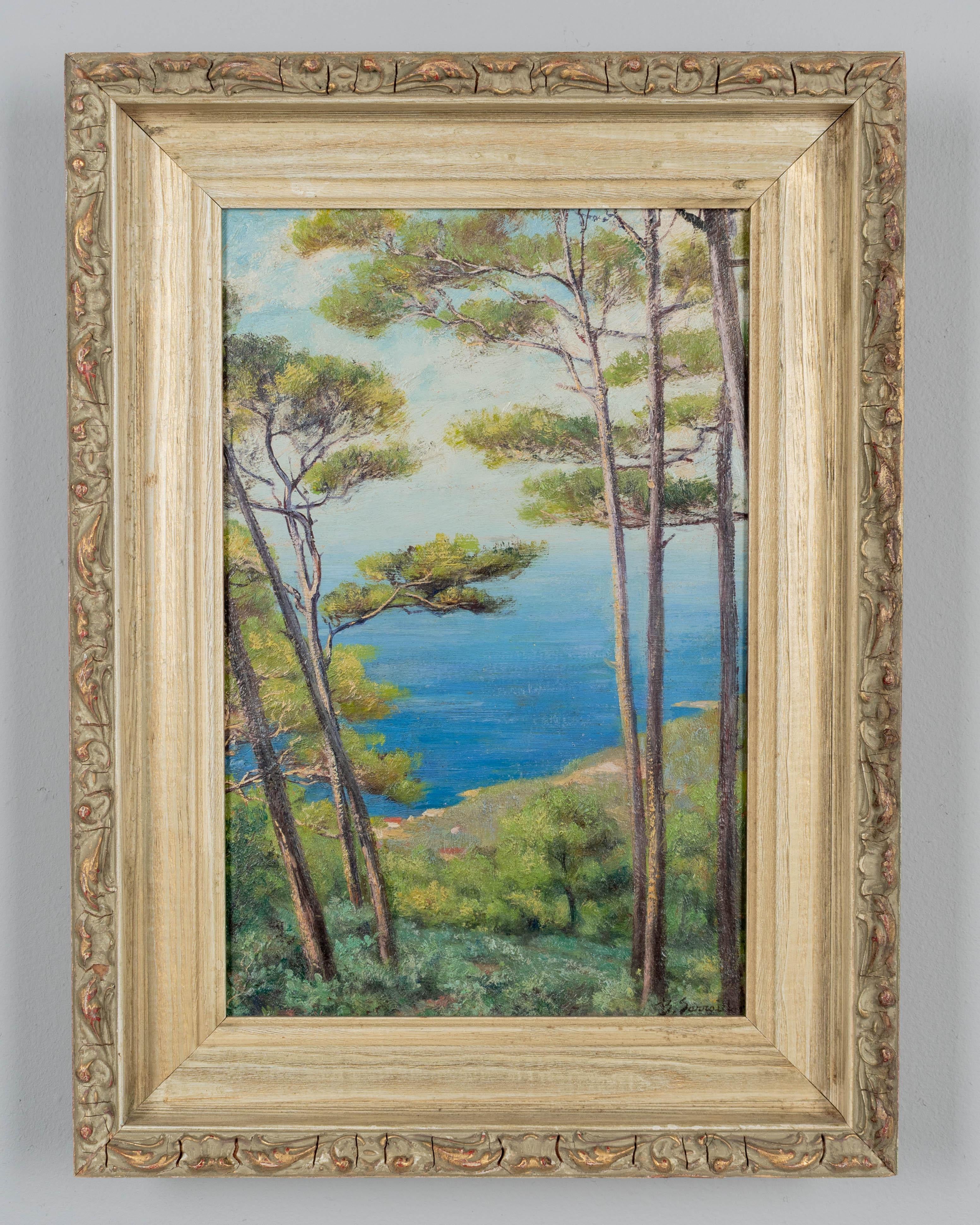 A Mid Century painting by French artist Benjamin Sarraillon (1902-1989) depicting a coastal landscape with a hilltop view of the Mediterranean through the pine trees. Oil on board. Signed lower right. Original frame. Circa 1950s
Dimensions: 12