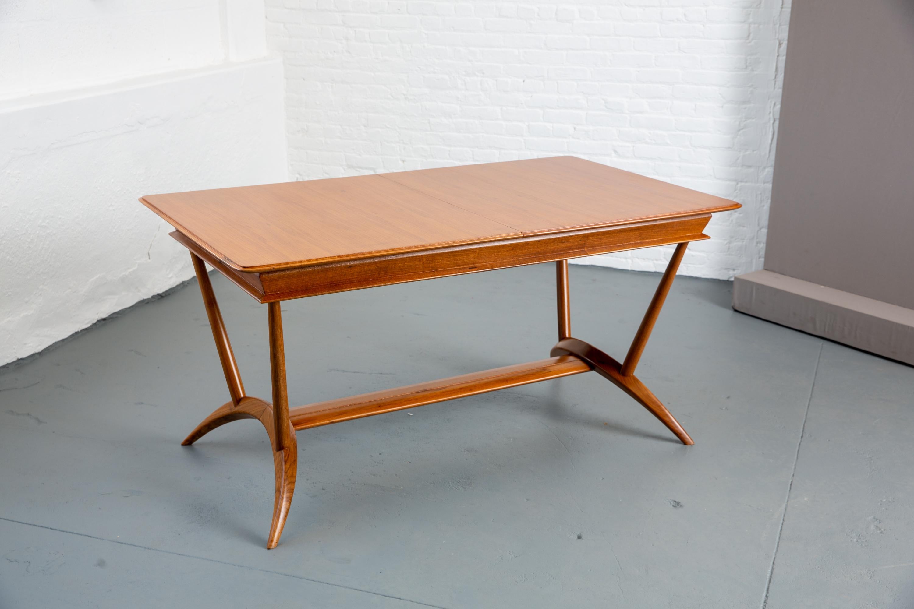 Beautiful 1940s MidCcentury French dining table with 1 leaf. Splayed leg base. Marked 