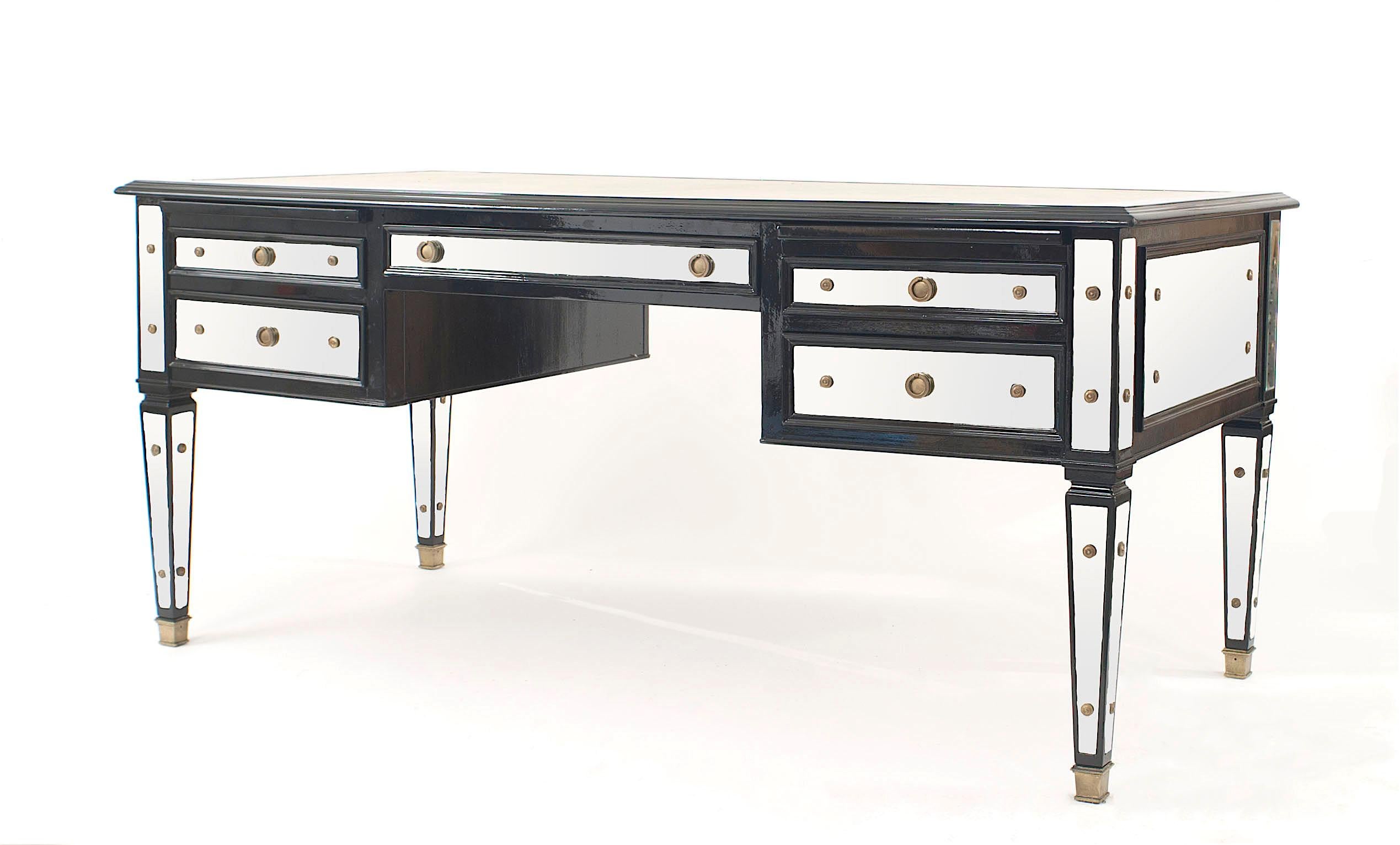 French mid-century (1940s) ebonized and mirrored desk with five drawers and an off-white leather writing surface (Maison Jansen).

Maison Jansen was a Paris-based interior decoration office founded in 1880 by Dutch-born Jean-Henri Jansen. Jansen