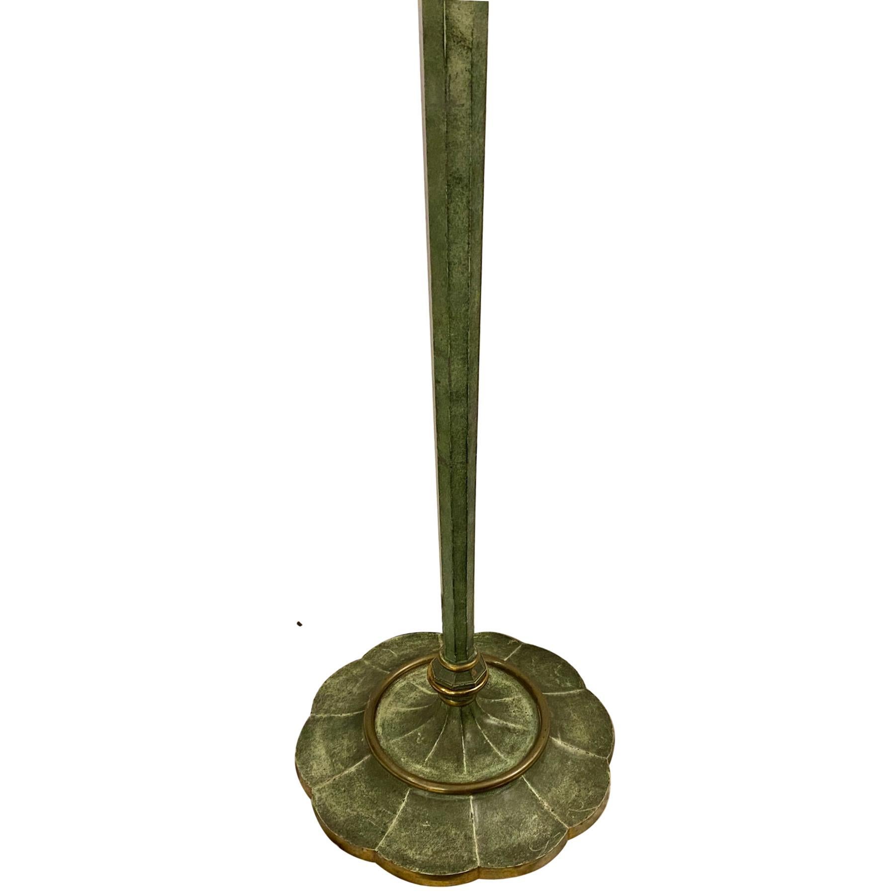 A circa late 1940's hand-painted metal floor lamp with base in the shape of a lilly pad and original patina.

Measurements:
Height of body: 58