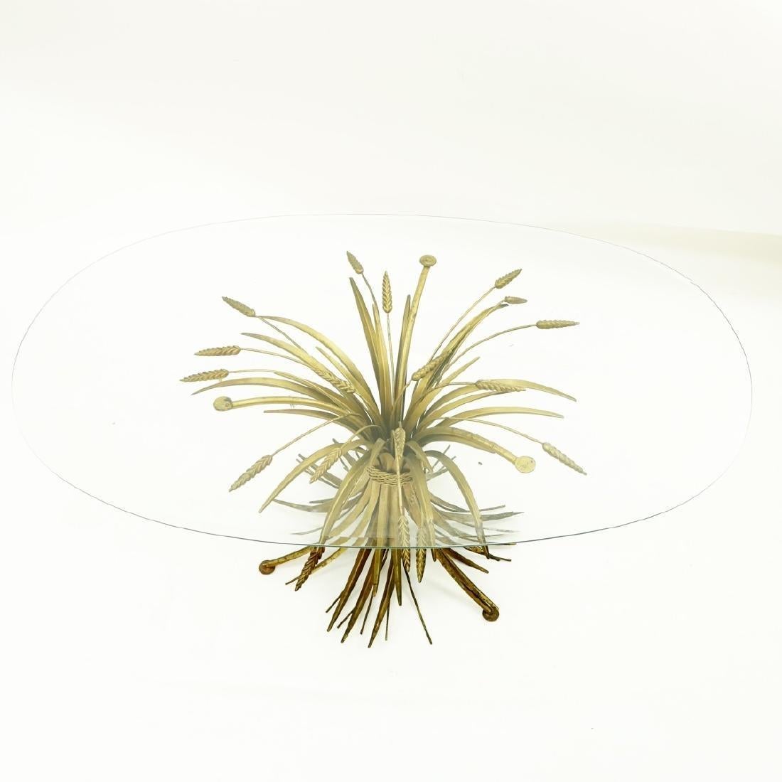 1970s Coco Chanel Sheaf of Wheat Gilt Oval Glass and brass table France Beautiful Hollywood Regency Modern gold French sculptural sheaf of wheat, ( Le Blé) coffee or side table. In the style of Baguès or Robert Goossens. This highly coveted