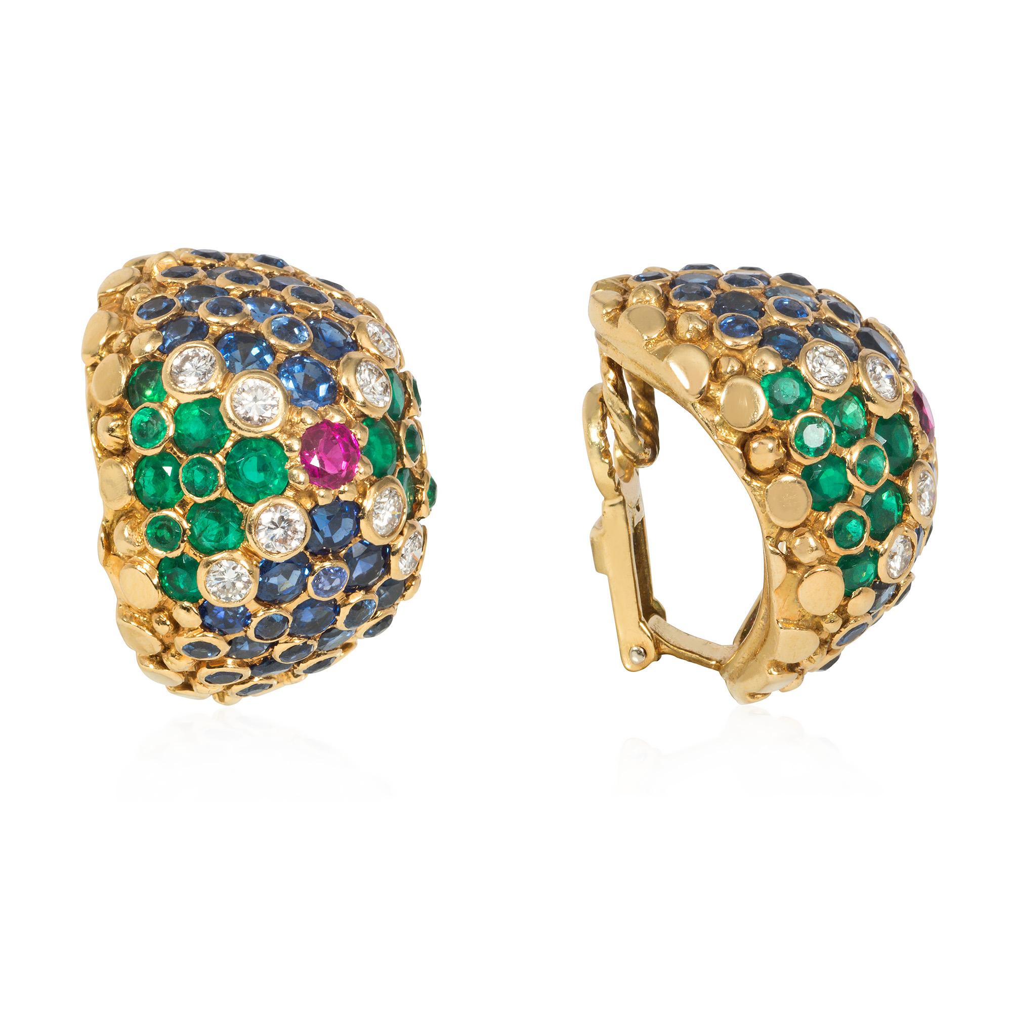 A pair of Mid-Century multi-gem and gold bombé clip earrings featuring opposing fields of emeralds and sapphires divided by collet-set diamonds, and centered by rubies, in 18k.  France.

* Includes letter of authenticity
* Free shipping
* Please do