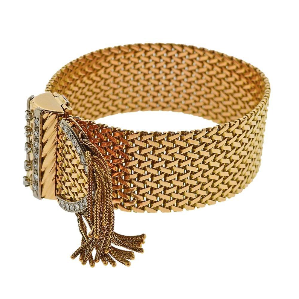 French made 18k yellow gold tassel bracelet, adorned with approx. 1.10ctw in diamonds. Bracelet is 9
