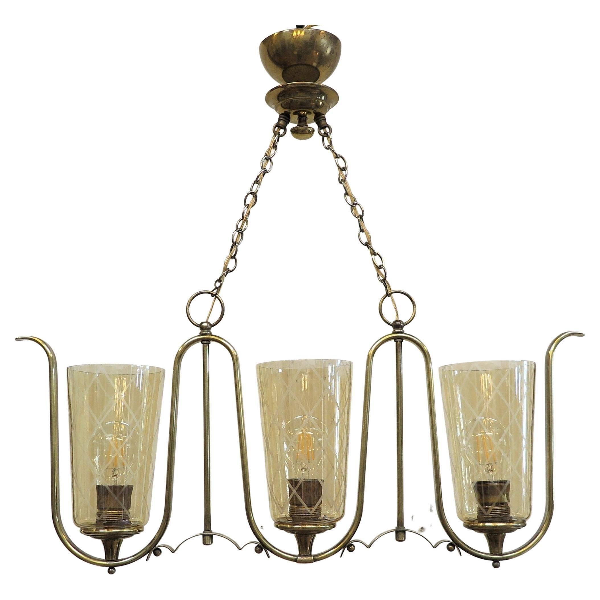 French mid century horizontal chandelier. French Serpentine Horizontal Brass Chandelier in the manner of Jean Royere. A spectacular Serpentine Horizontal Brass Chandelier distinctly in the design style and attributes of French Designer Jean Royere.