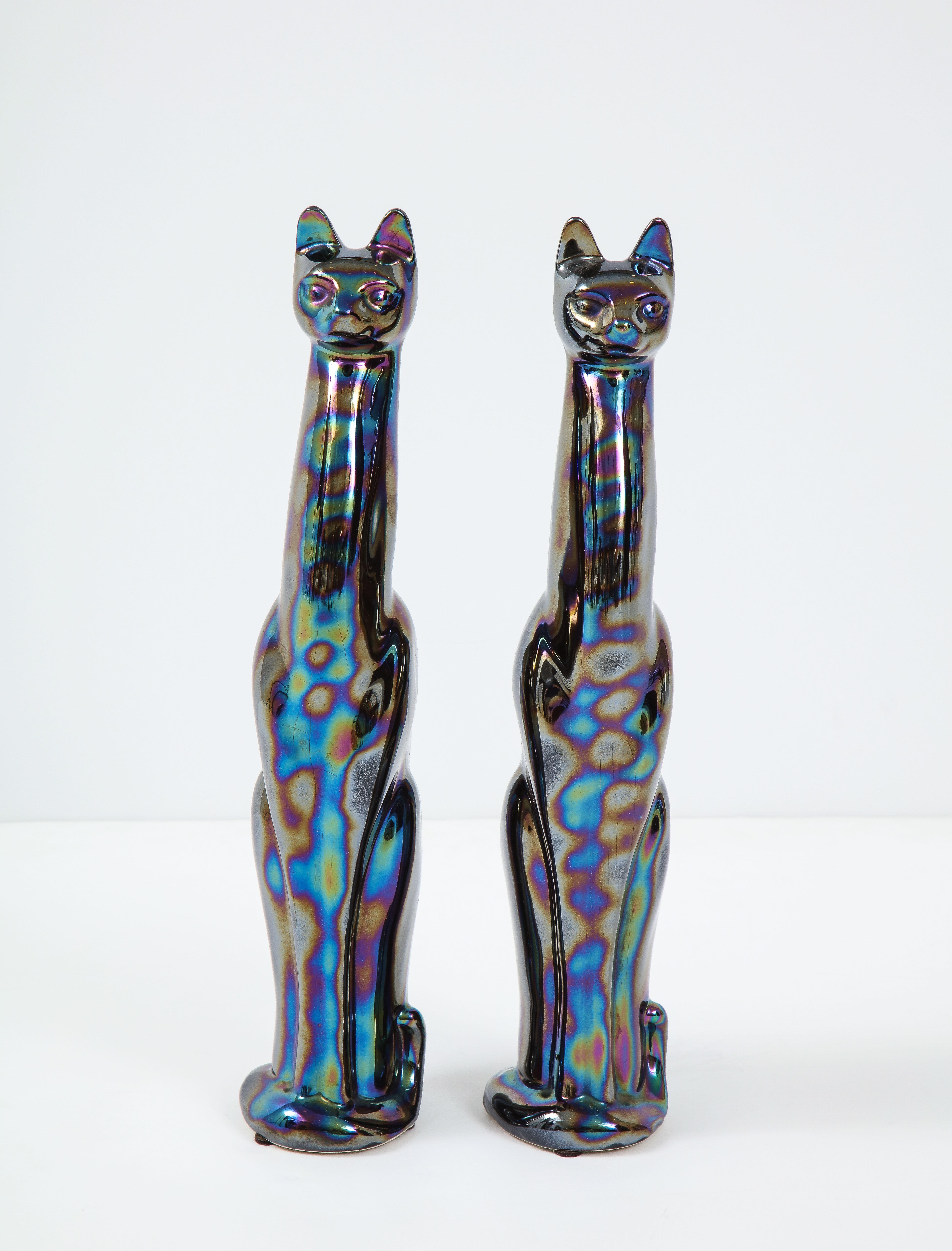 Pair of French midcentury stylized cat figures featuring an iridescent glaze.