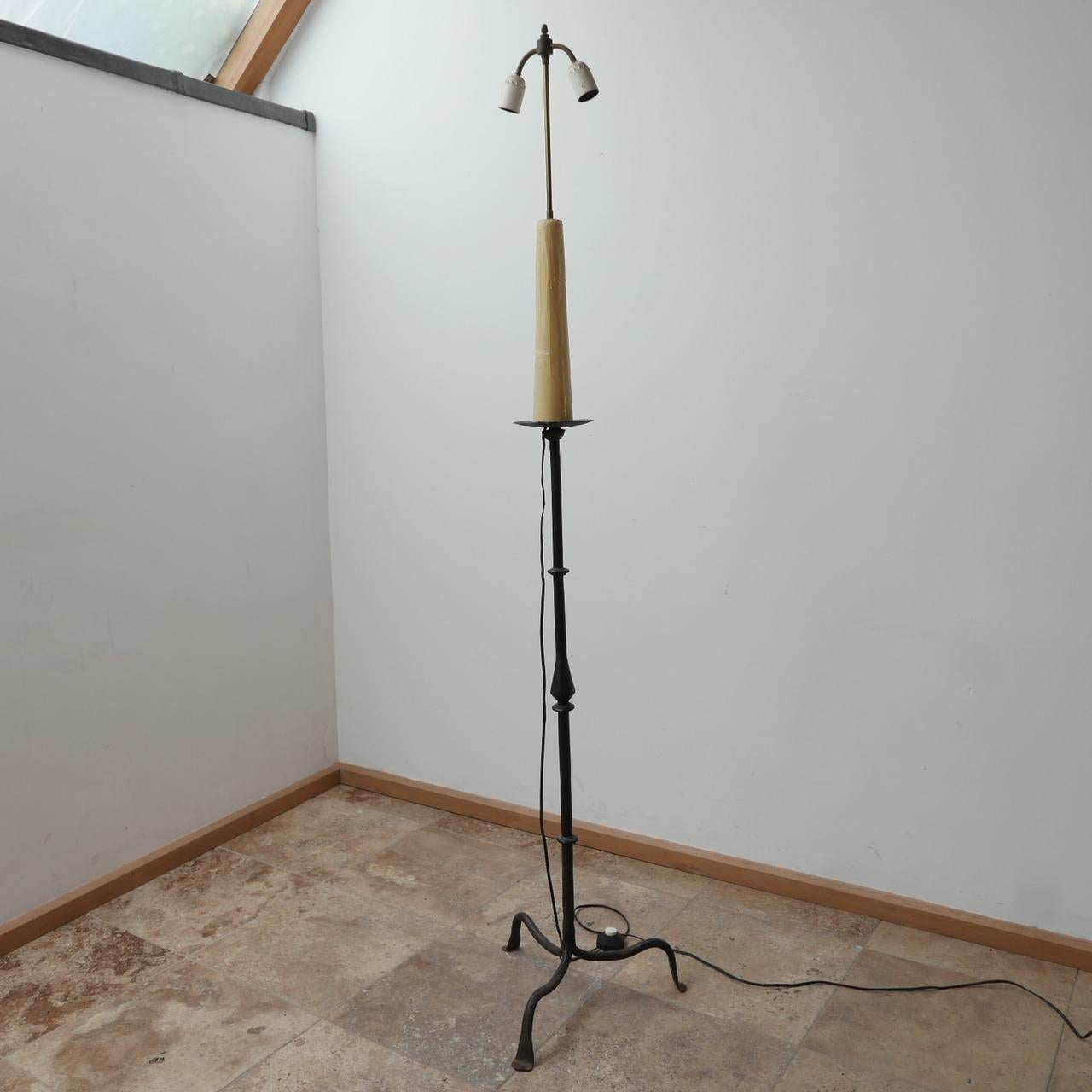 A tall iron floor lamp. 

France, c1950s. 

Original wax embellishment retained. 

Some wear to the wax but generally good condition. 

Since re-wired and PAT tested. 

Dimensions: 183 H x 40 W x 40 D in cm. 

Delivery: POA.
