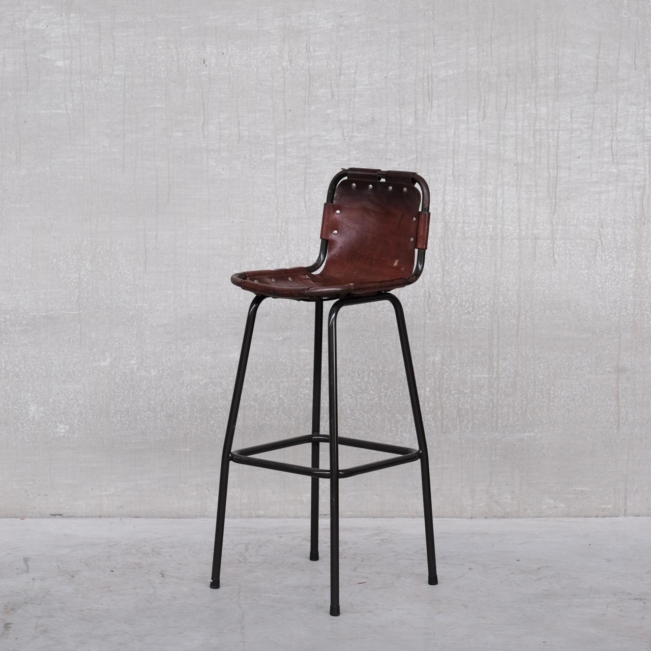 A good run of bar stools. 

France, c1960s. 

In the manner of the Perriand dining chairs. 

Leather and iron. 

The leather is has patina consistent with age but is not torn. 

The iron again has patina and wear but structurally is fine.