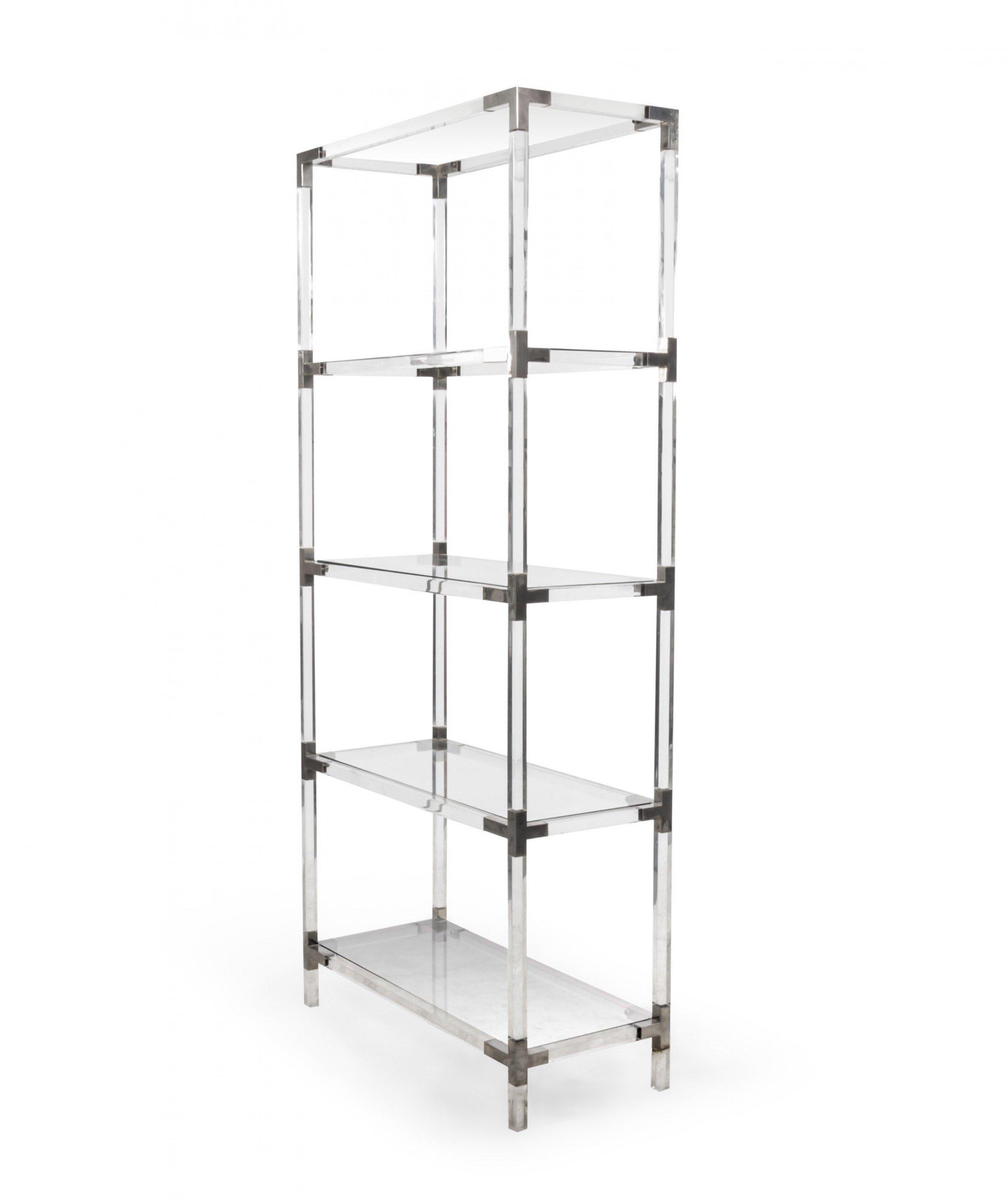 French midcentury Lucite étagère / bookshelf with accented metal hardware and glass shelves in the style of Maison Jansen.