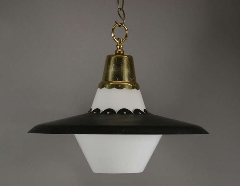 A 1960s mid century glass and black scalloped dish single light pendant.
Take one 100 watt Edison bulb.