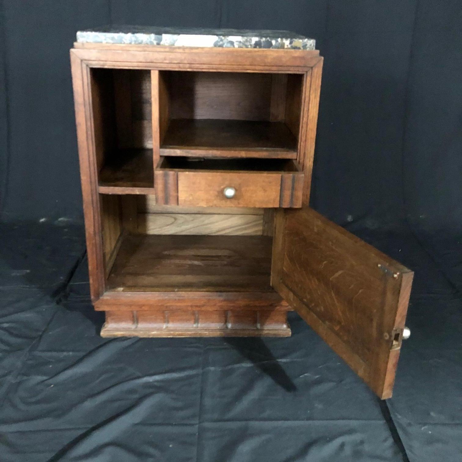 Wonderful oak midcentury French Art Deco side table or nightstand having one drawer and two open sections for books and sundries. Handsome thick marble top.
#5201.
