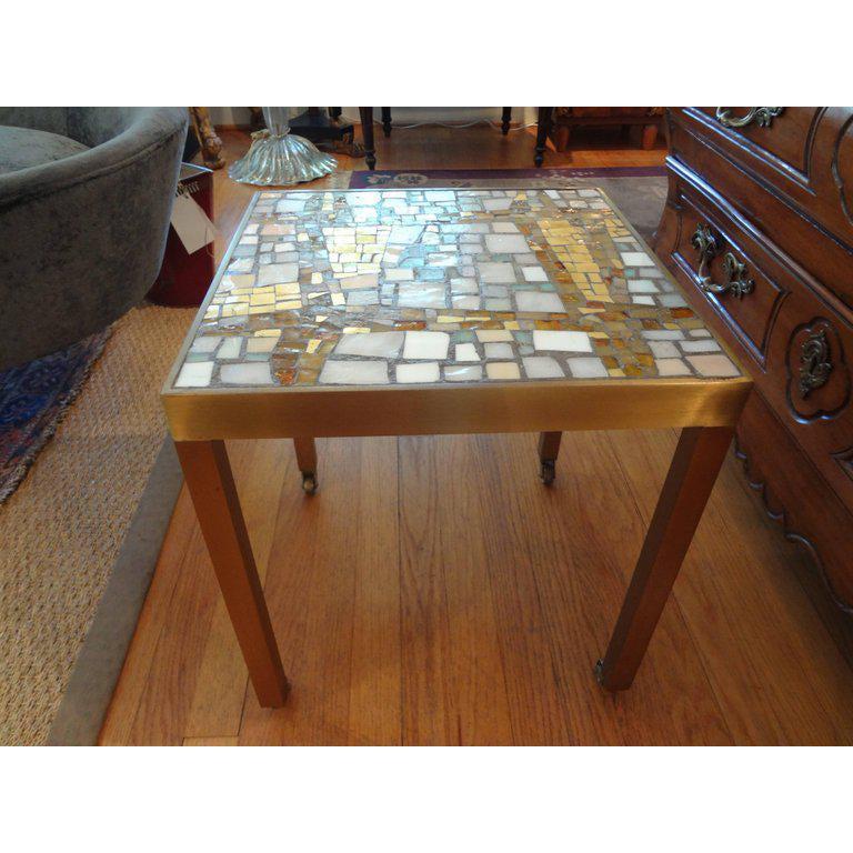 French Modernist brass table with a glass mosaic tile-top, circa 1960. This French Mid-Century Modern side table or gueridon would work well in a variety of interiors including modern, midcentury or Hollywood Regency.