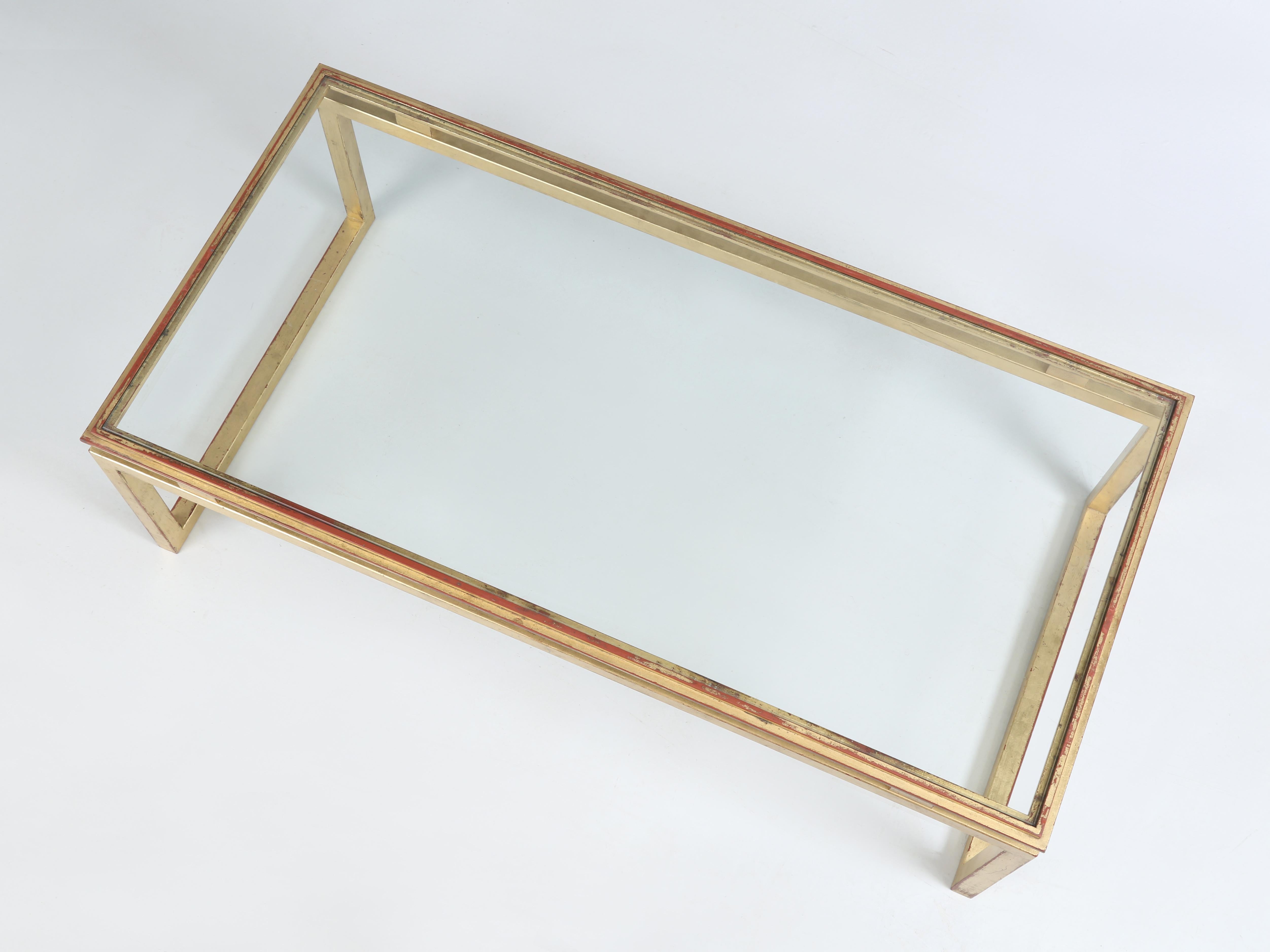 Over the course of the last 30-years we have imported a fair number of 20th century modern gilt metal coffee tables in a similar style, which were attributed to “Maison Ramsay – Paris”. This particular mid-century modern gilt metal and glass coffee
