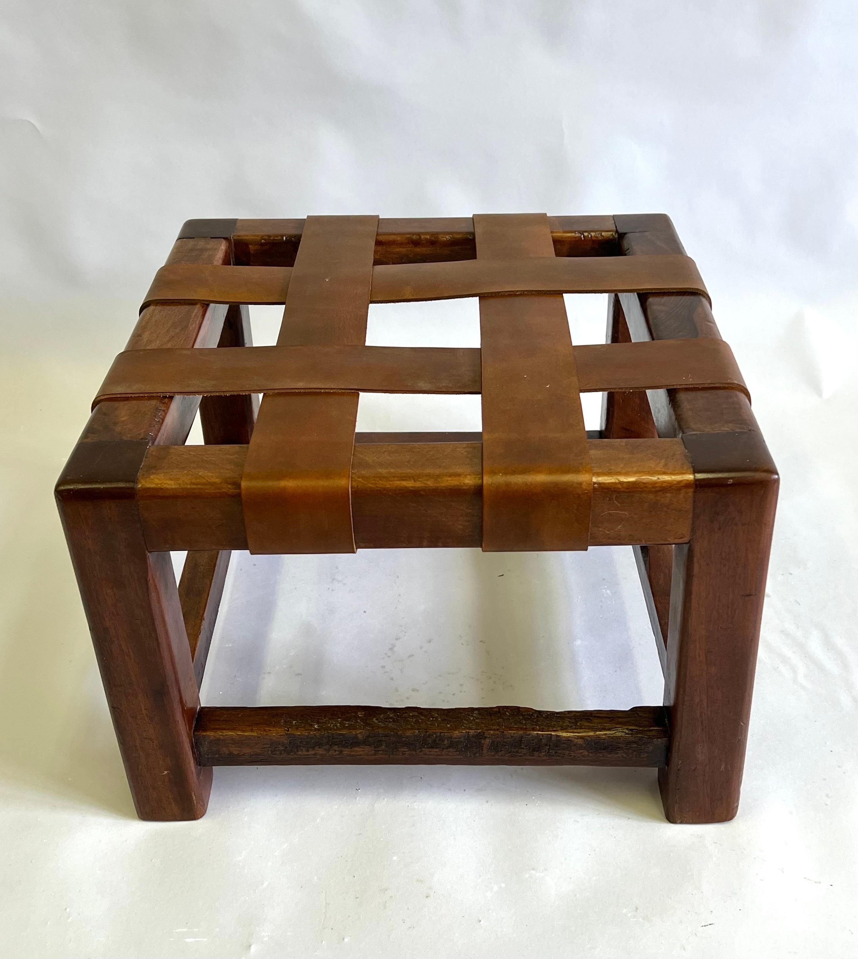 Rare French Midcentury / Late Art Deco, Hand Made Stool or Bench in the style of Jean Michel Frank. The piece is composed of hand hewn hardwood and wide hand crafted leather straps arranged in a rhythmic geometric pattern. This exquisite and