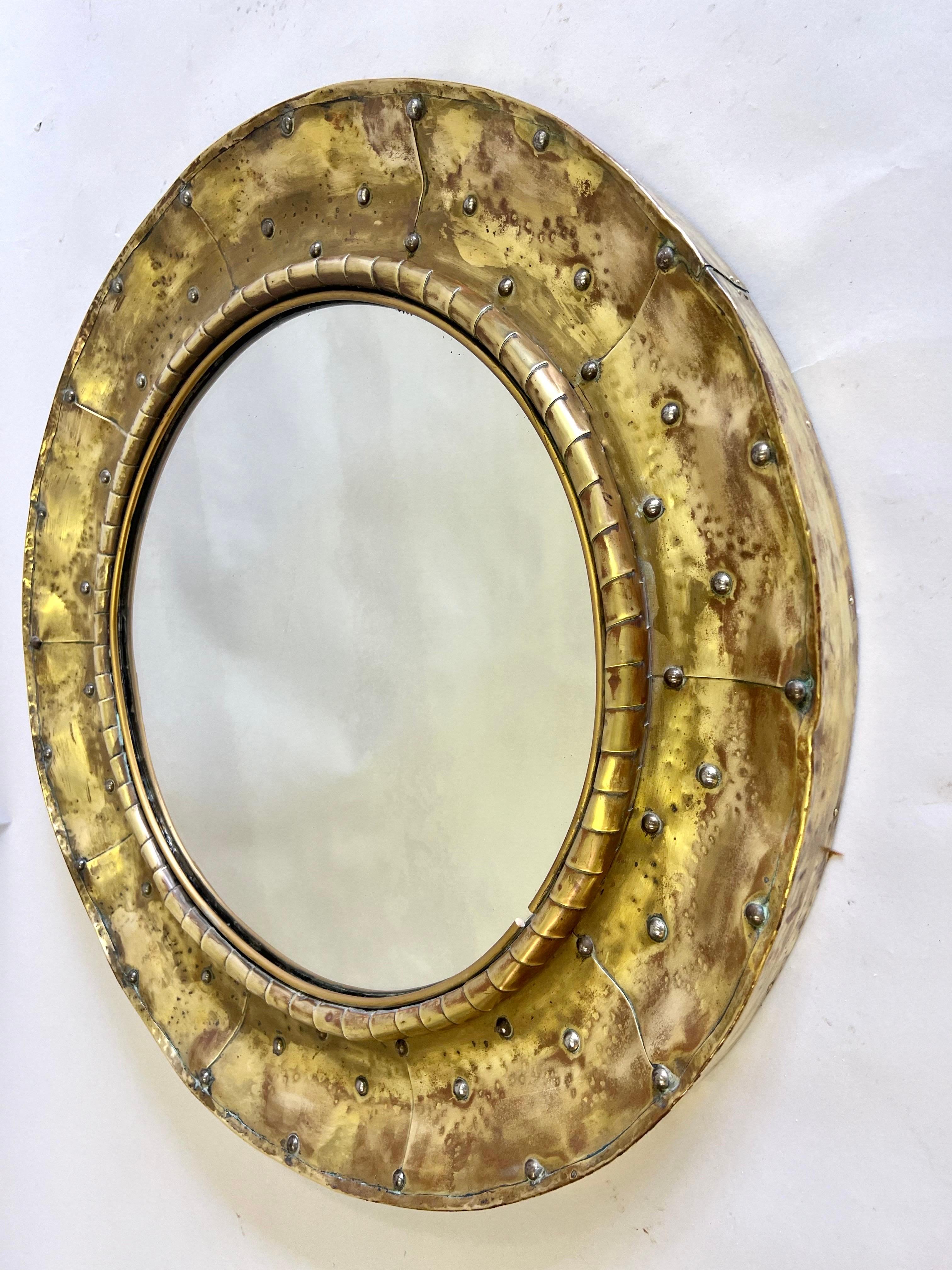 Rare and Unique, one of a kind, hand hammered copper and brass French Modern Craftsman, Round Mirror, Paris, circa 1970. Hand signed by the artist on the rear of the mirror,

Dimensions: Diameter: 25.75 x Depth: 2.5”

Additional References: Line