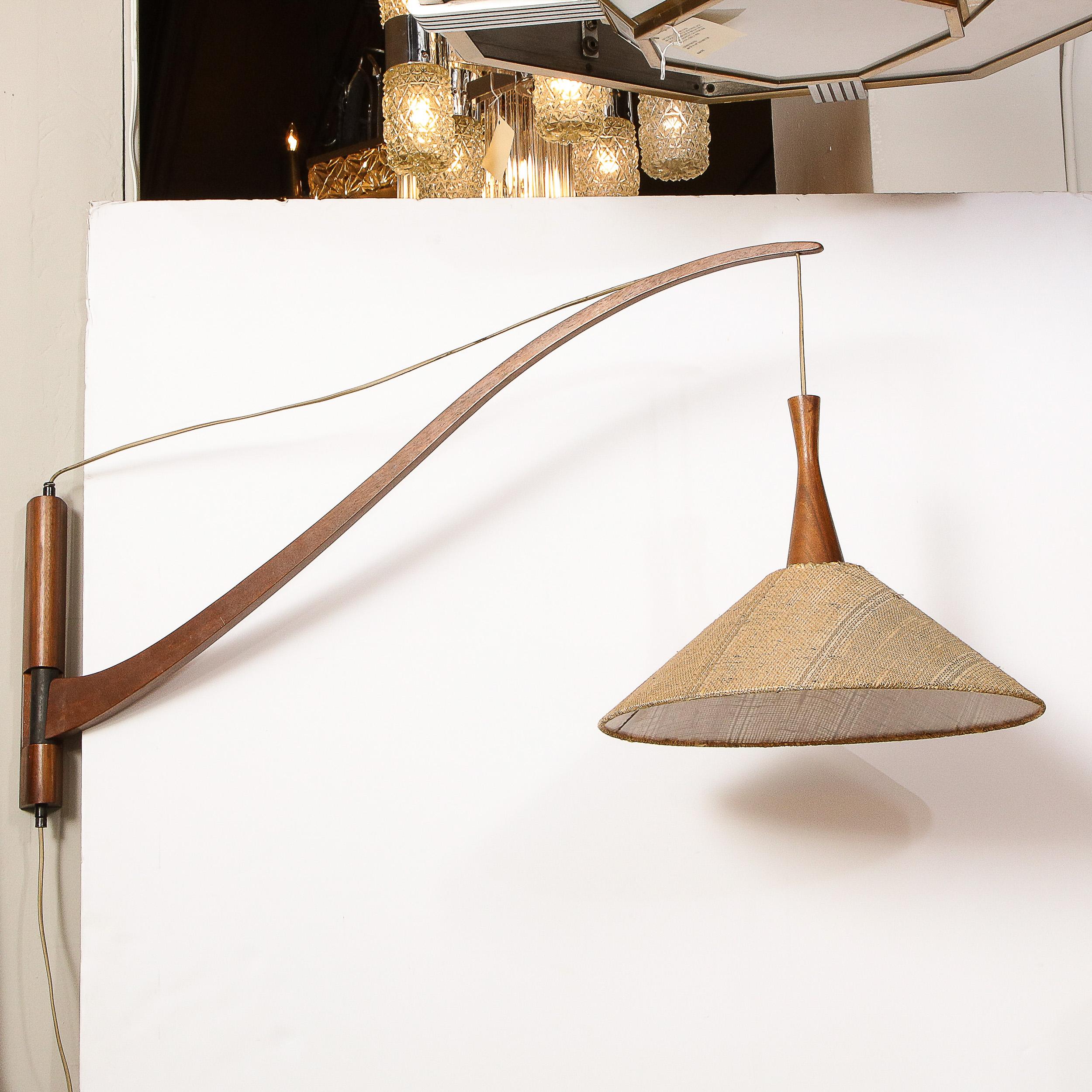 French Mid-Century Modern Handrubbed Teak Swing-Arm Wall Sconce w/ Hessin Shade In Excellent Condition In New York, NY