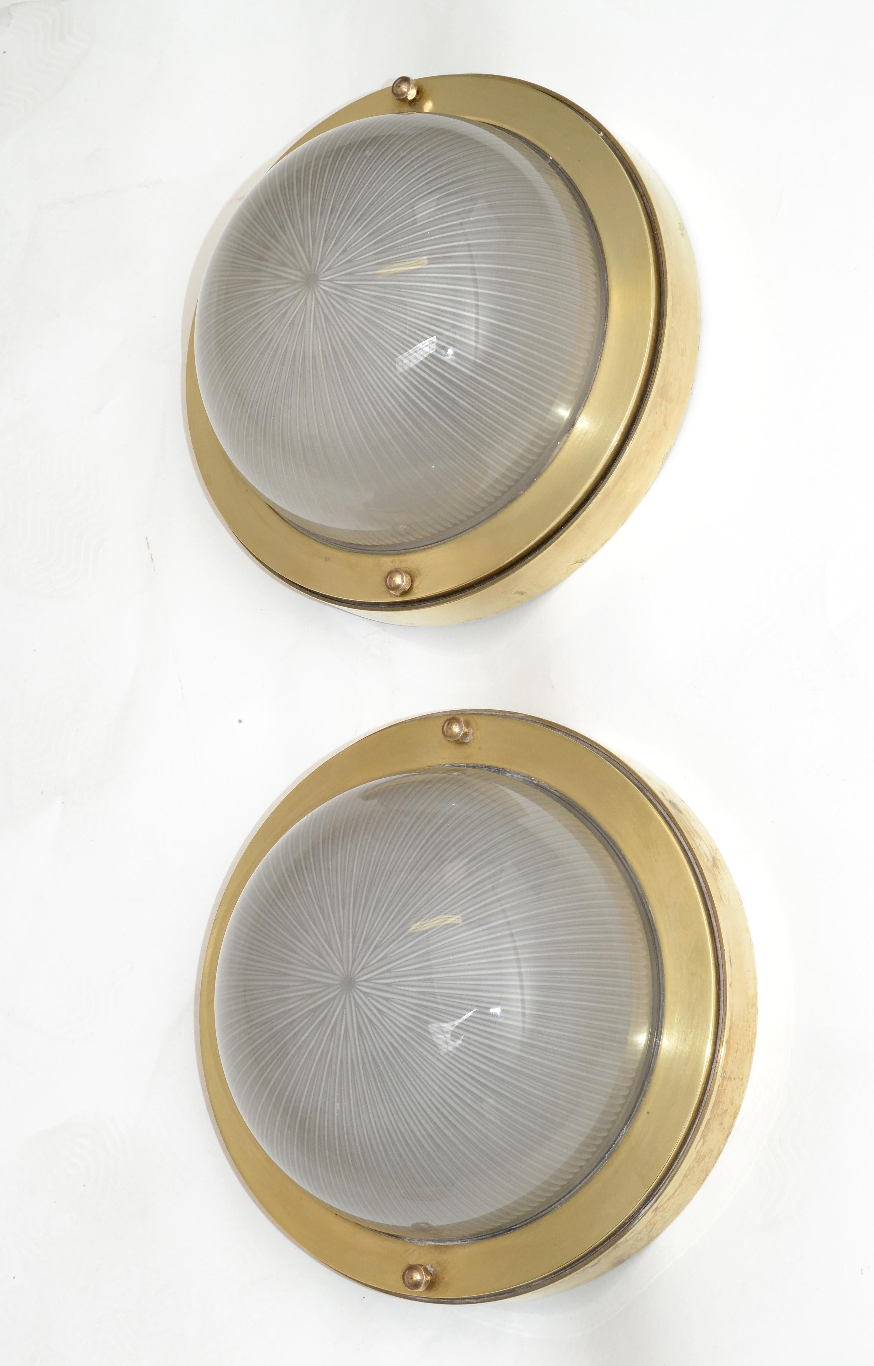 A pair of French Mid-Century Modern Holophane glass shades and bronze sconces, wall lights, flush mount from the 1950s.
Working condition and each takes 2 Light Bulb, max. 40 watts.
 