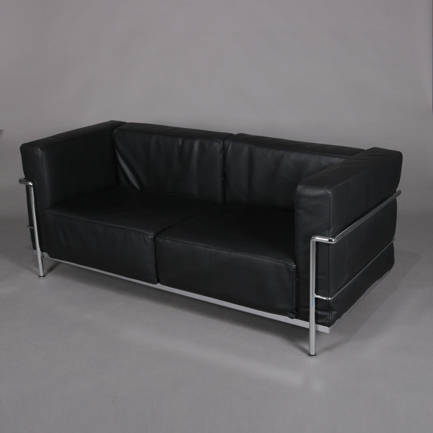 A French Mid-Century Modern sofa features cube form with chrome gridded frame and black leather upholstery, circa 1960

Measures: 27