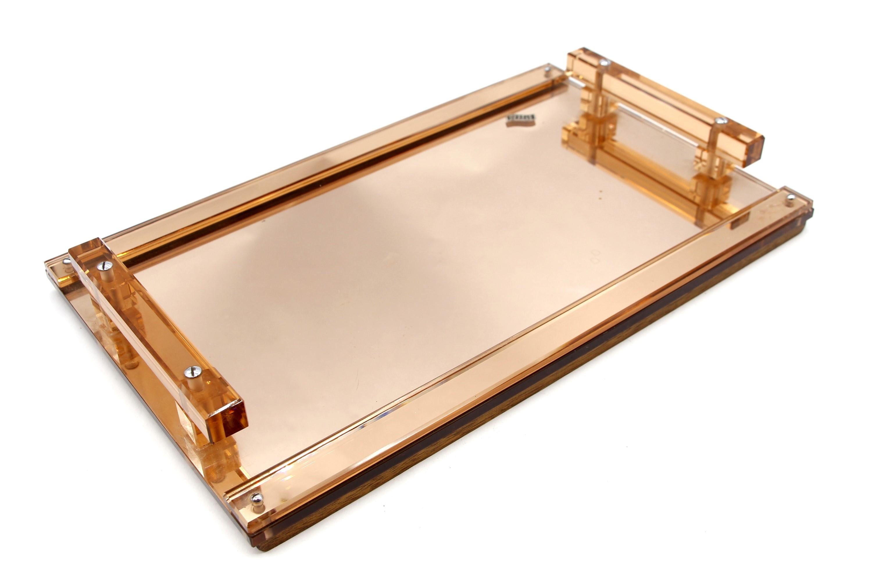1950s Mid-Century Modern French champagne colored Lucite serving tray. Bottom of the tray is backed with mirror and two wood strips to provide stability. Original tag says 