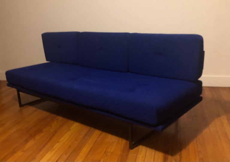 An early French Architectural Mid-Century Modernist sofa / daybed by A.R.P. Atelier de Recherche Plastique and with a fabric color similar to Yves Klein Blue. The sofa / divan presents a pure 1960 architectural statement in its rectilinear,