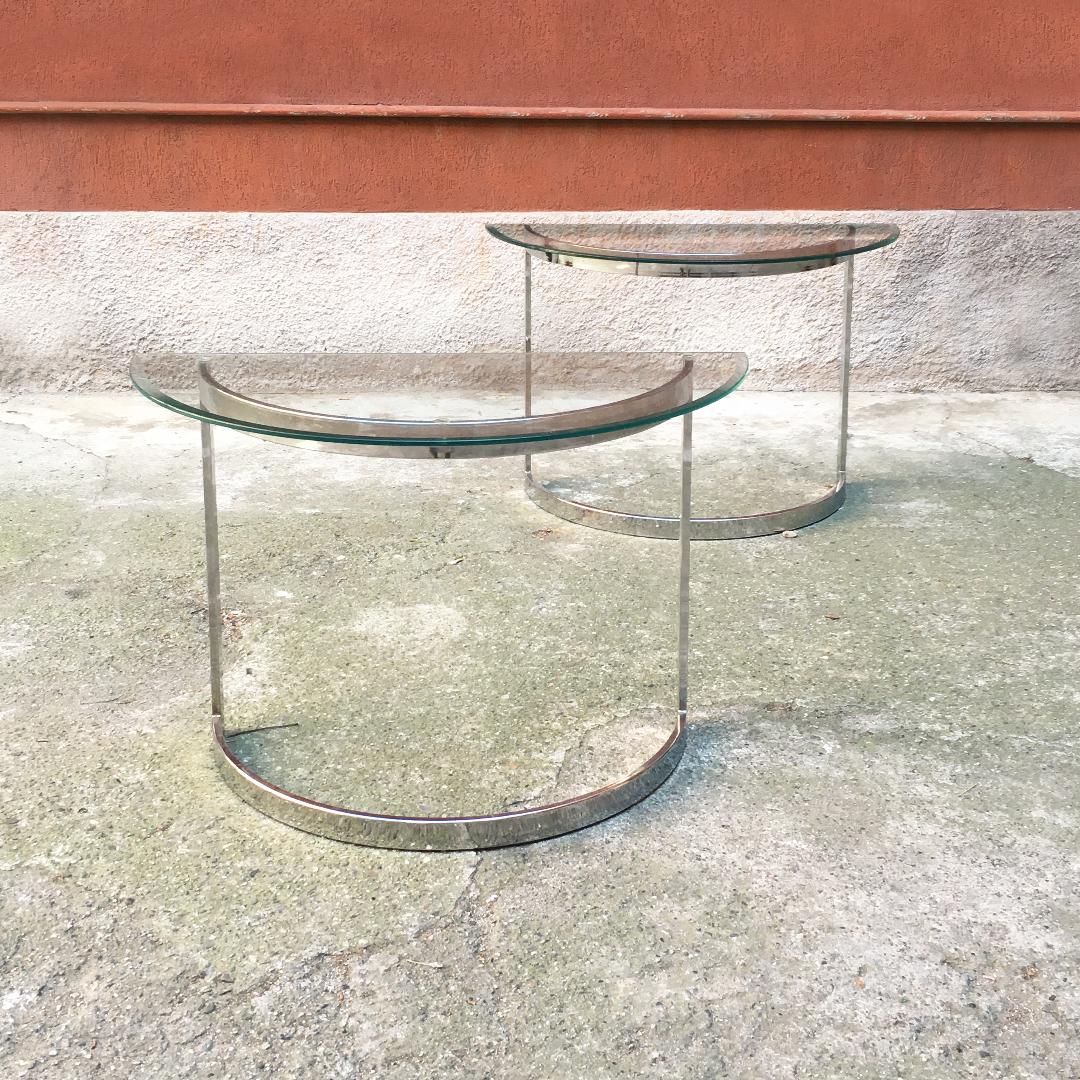 French Mid-Century Modern steel consoles with glass top, 1970s
Pair of steel consoles from Paris, with semicircular top in beveled glass and base structure in chromed steel,
1970s

Good condition, small chipping on one edge of each of the