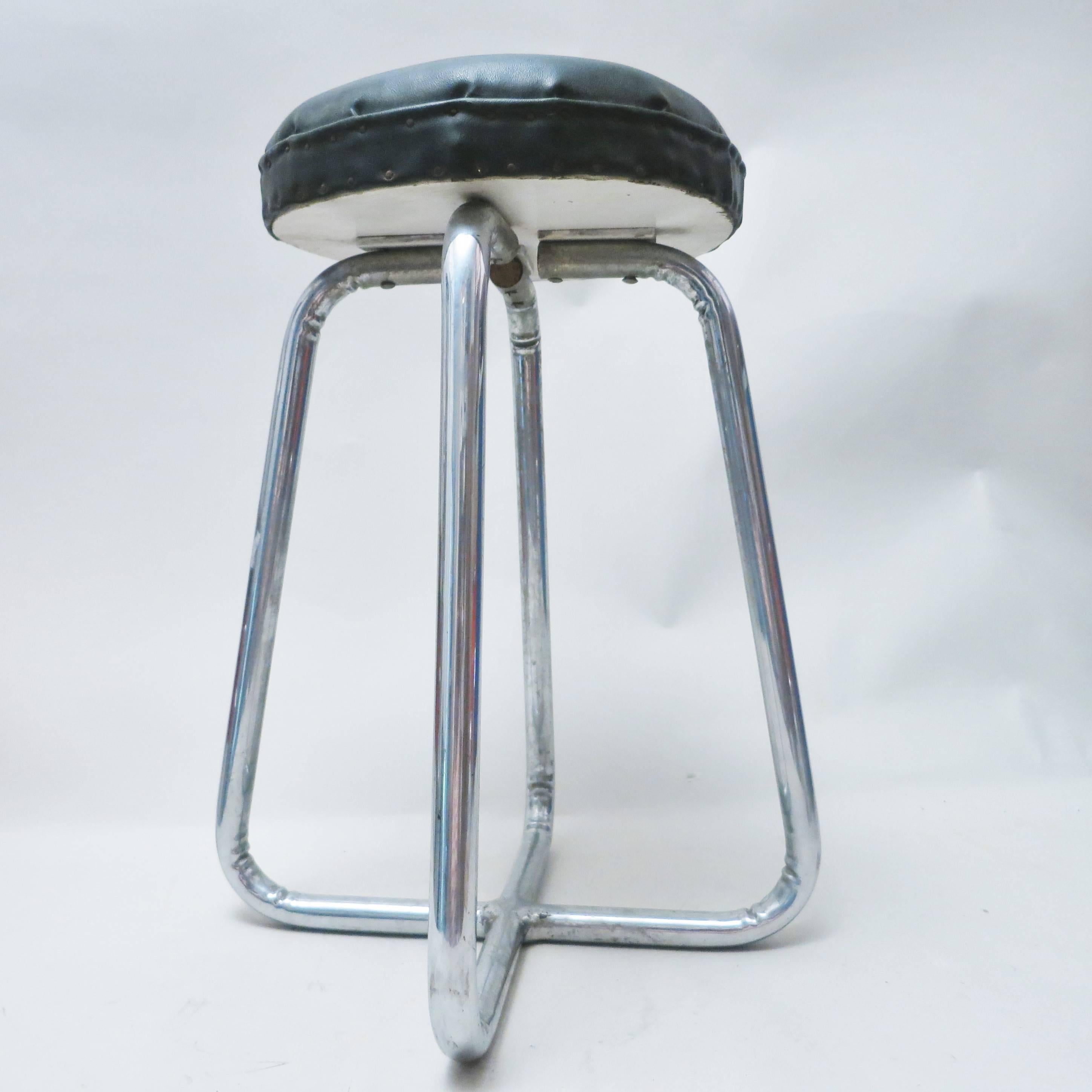 French Mid-Century Modern stool in the manner of Jacques Adnet.