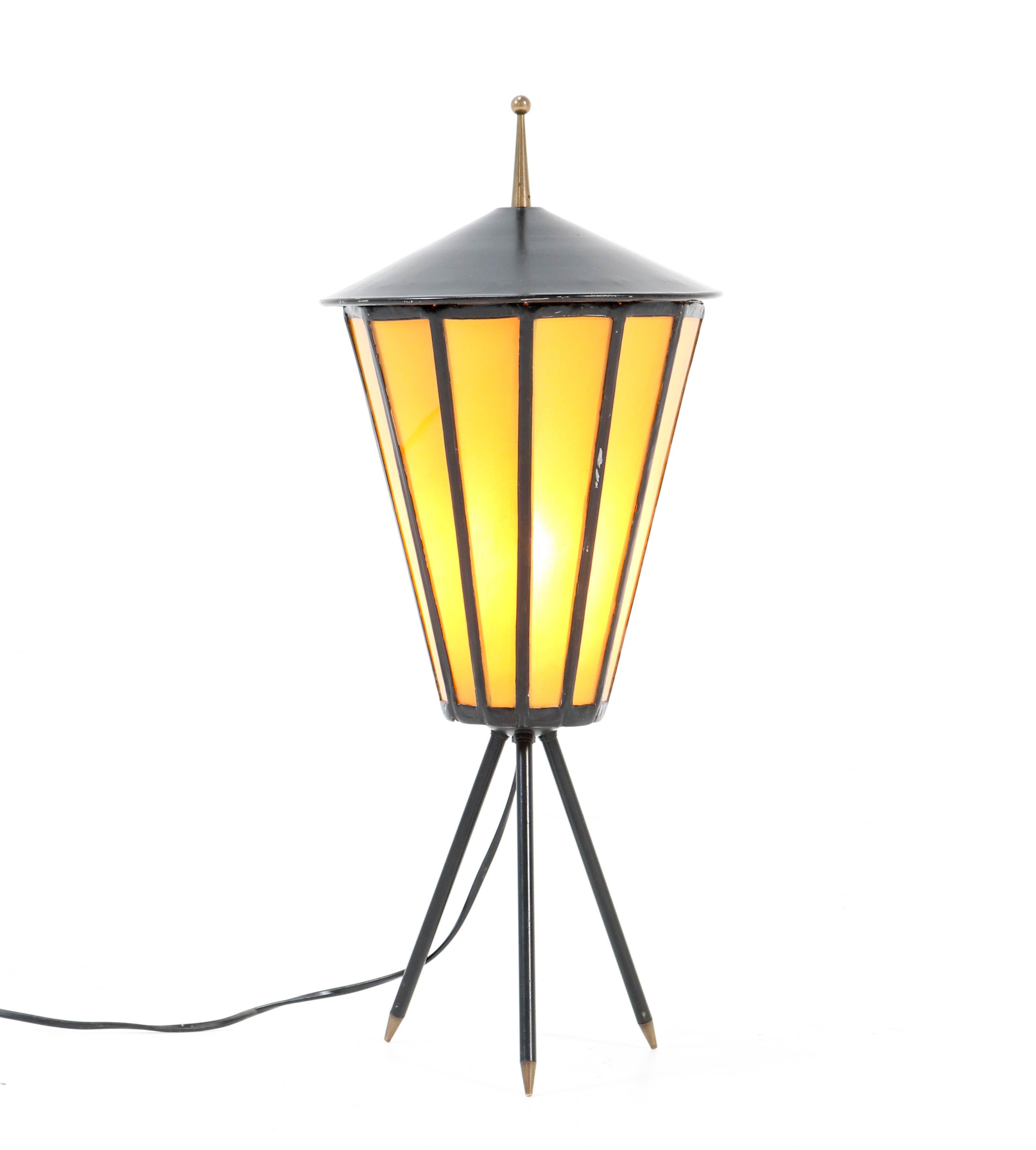 Stunning Mid-Century Modern table lamp.
Striking French design from the 1950s.
Black lacquered metal base on tripod legs.
Original yellow colored glass.
Rewired with a socket for E27 light bulb.