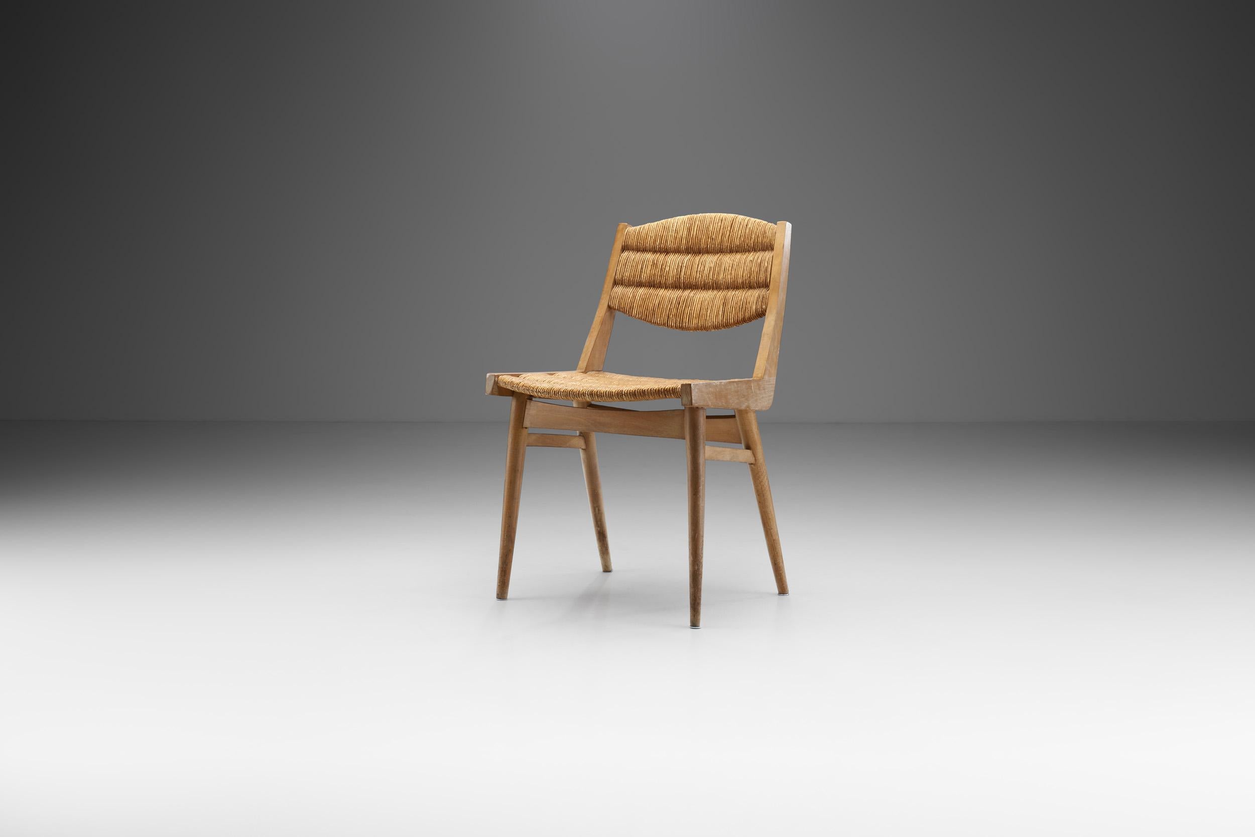 This small mid-century French chair combines a visually stunning structural body with an expert caning technique and high quality materials. 

As with the UK and much of Europe, there was something of a design renaissance in France in the 1950s,