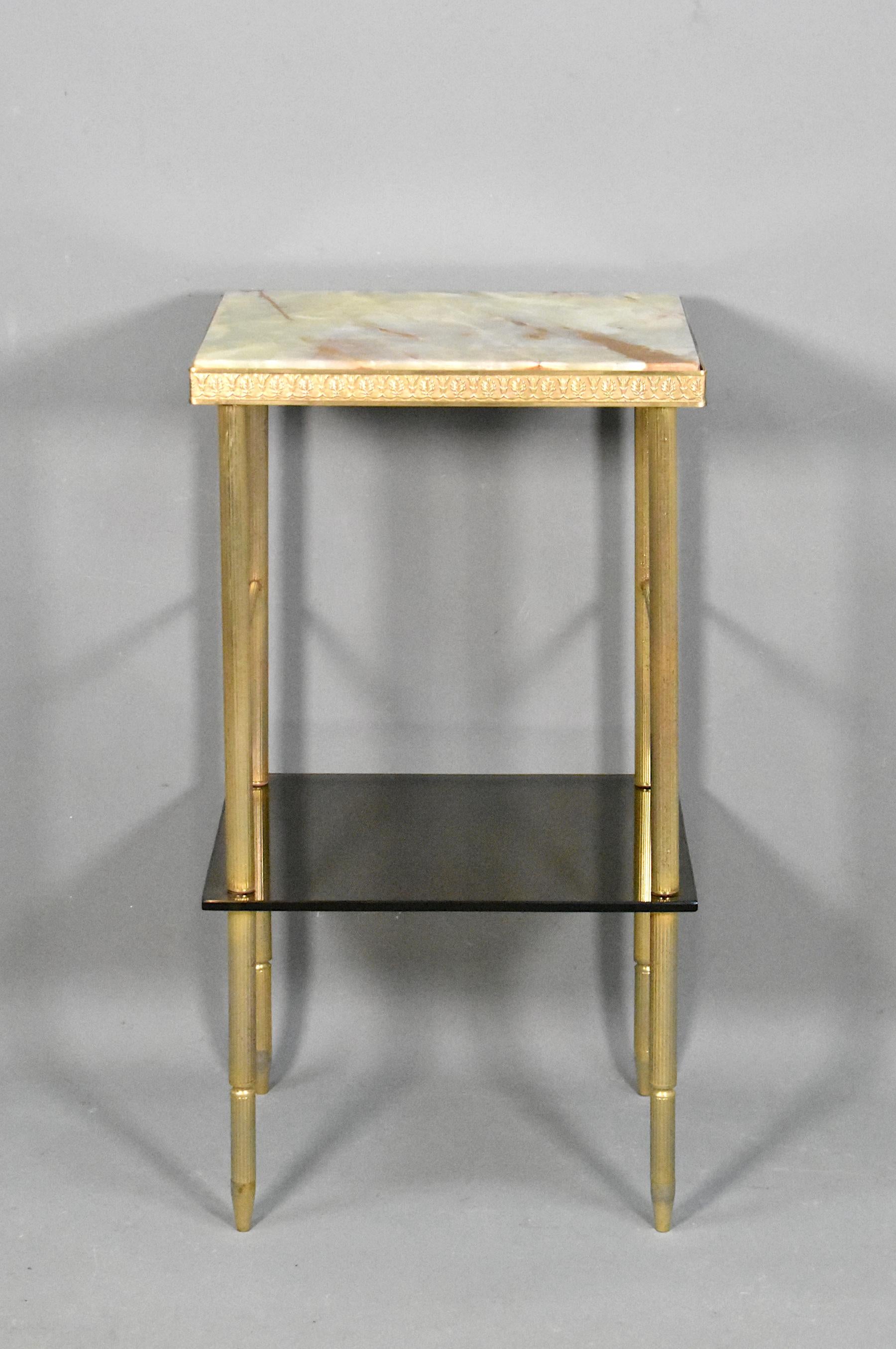 French mid century onyx and glass side table

A good example of quality craftsmanship is evident in the construction of this well-proportioned side table. 

Featuring an attractive onyx figured top, which is held in place by a floral decorated