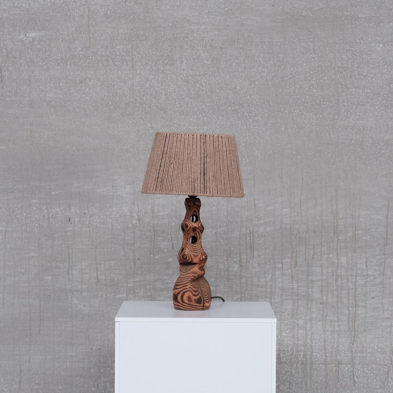 A sculptural carved wood table lamp. 

Paired with a rope cord shade. 

France, c1970s. 

Since re-wired and PAT tested. 

Location: Belgium Gallery. 

Dimensions: 38.5 height x 13 diameter in cm without the shade. 

Delivery: POA.


 