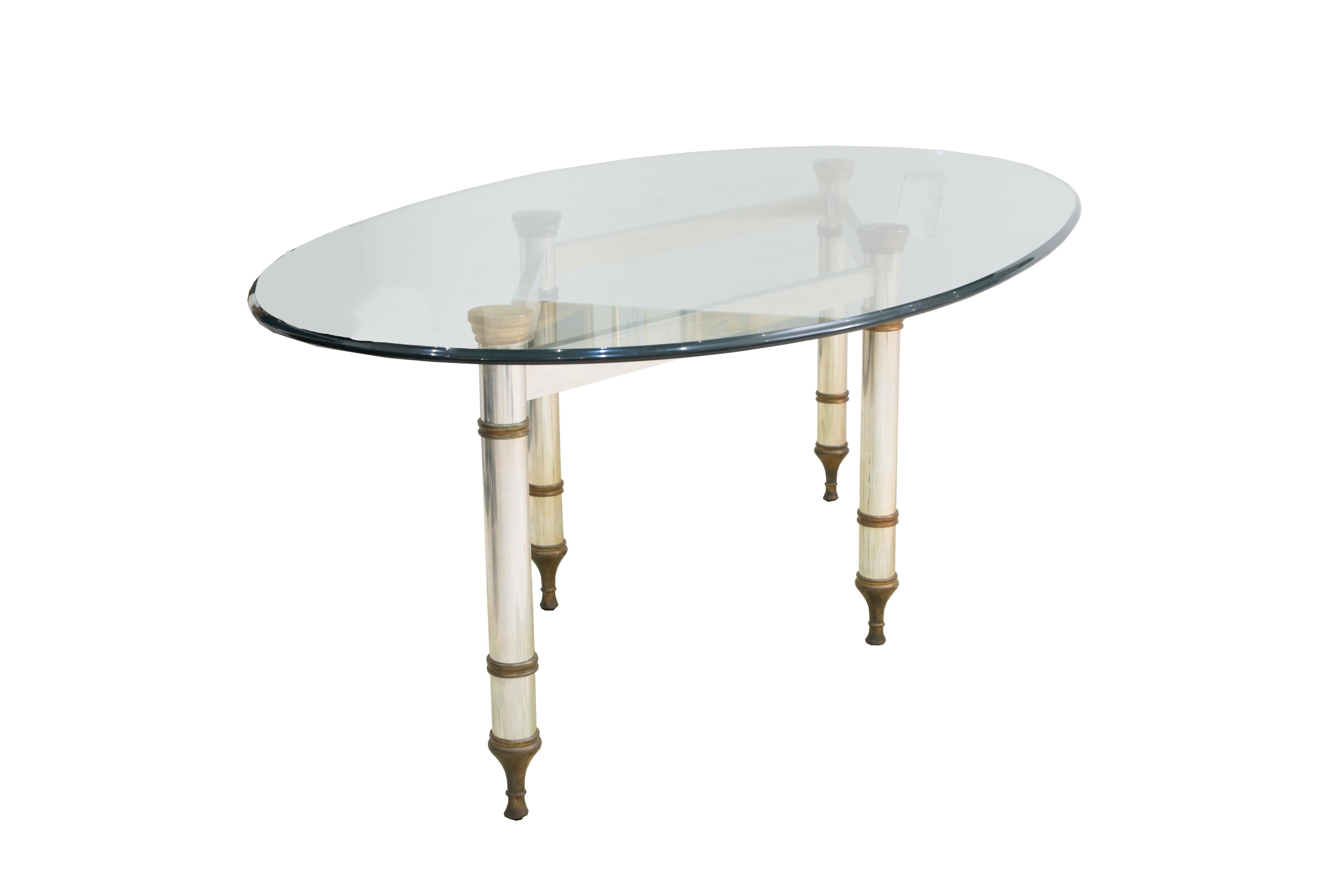 French midcentury oval dining table with a two-tone diamond form chrome and bronze base supporting an oval glass top. (style of Maison Jansen, circa 1970).