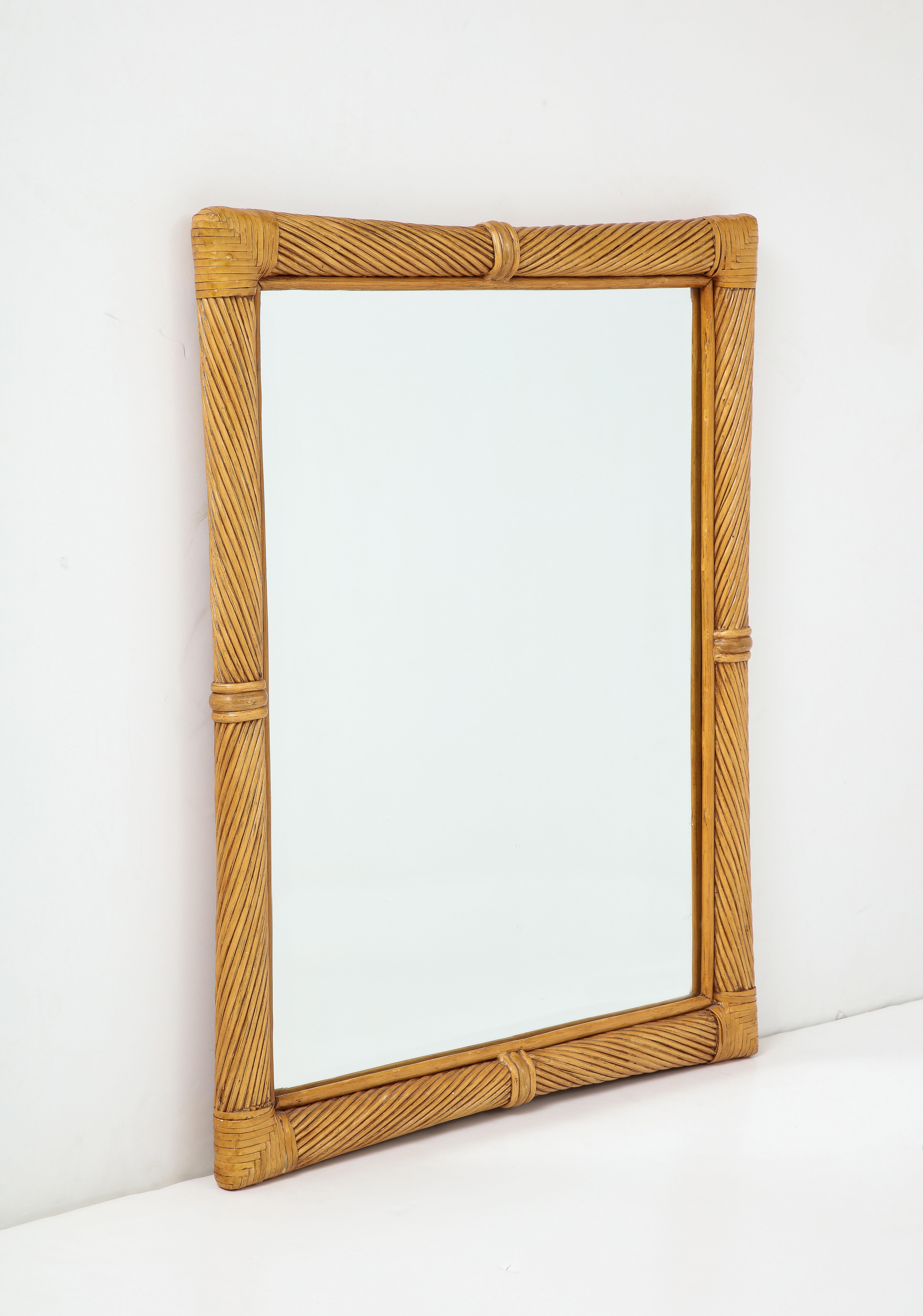 Midcentury French mirror featuring a hand wrapped pencil reed frame. Mirror can be oriented vertically or horizontally.