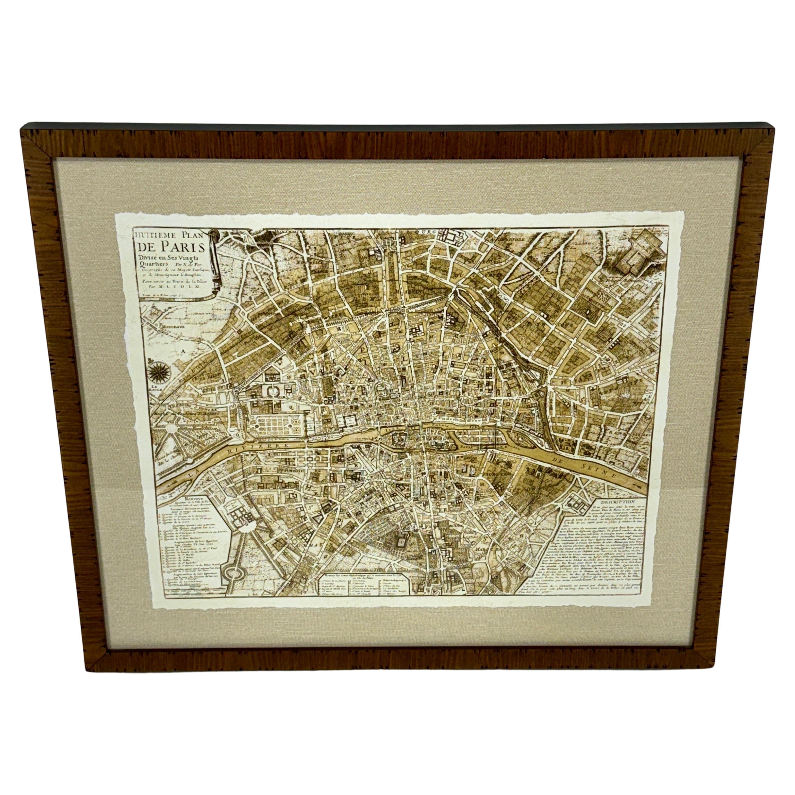 Custom Wooden Framed Map of 1700's Hundreds Paris, France. 

This reprint of the early antique map of the capital and most populous city in France has been deckled over a neutral colored linen mat. This artwork was purchased in France and was later