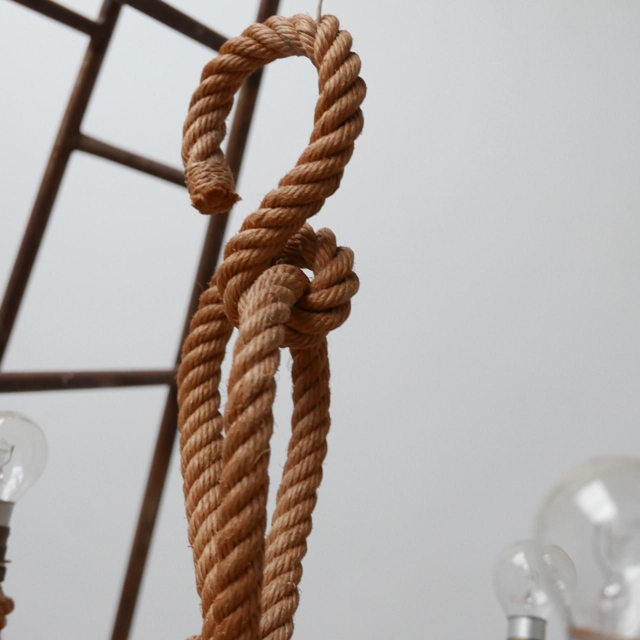 Audoux et Minet rope chandelier.

French, circa 1960s.

Three bulb arms.

Looks amazing paired with a cord shades.

Dimensions: 34 W x 34 D x 42 H in cm.
  