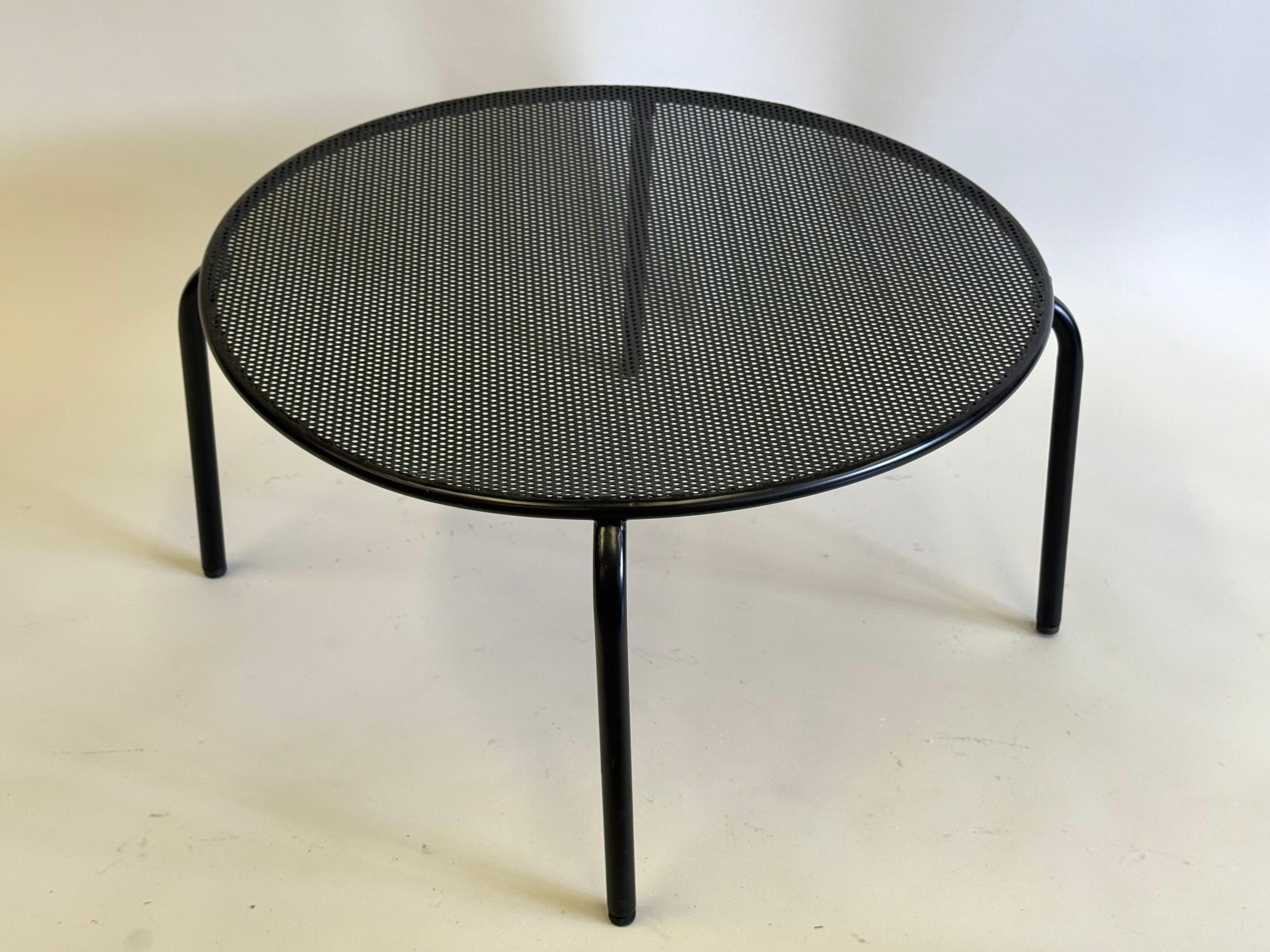 3 French Mid-Century Modern Circular Perforated Iron Coffee or Side Tables Attributed to Mathieu Margot. The pieces are available individually or as a pair and feature the classic Mategot aesthetic of using perforated iron or steel to convey