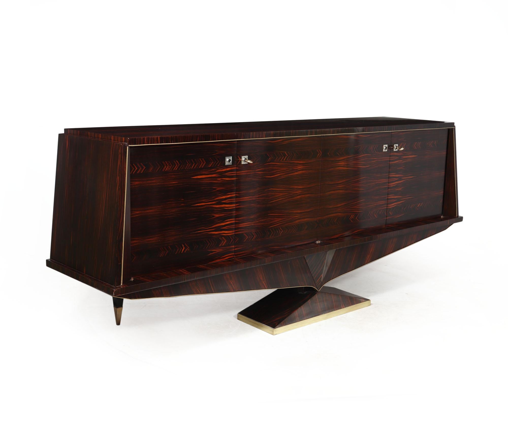 MID CENTURY SIDEBOARD IN MACASSAR 
Introducing a stunning 1960s Macassar sideboard, straight from France. The exquisite design showcases the rich and striking grain of Macassar wood, creating a captivating visual impact. Offering both form and