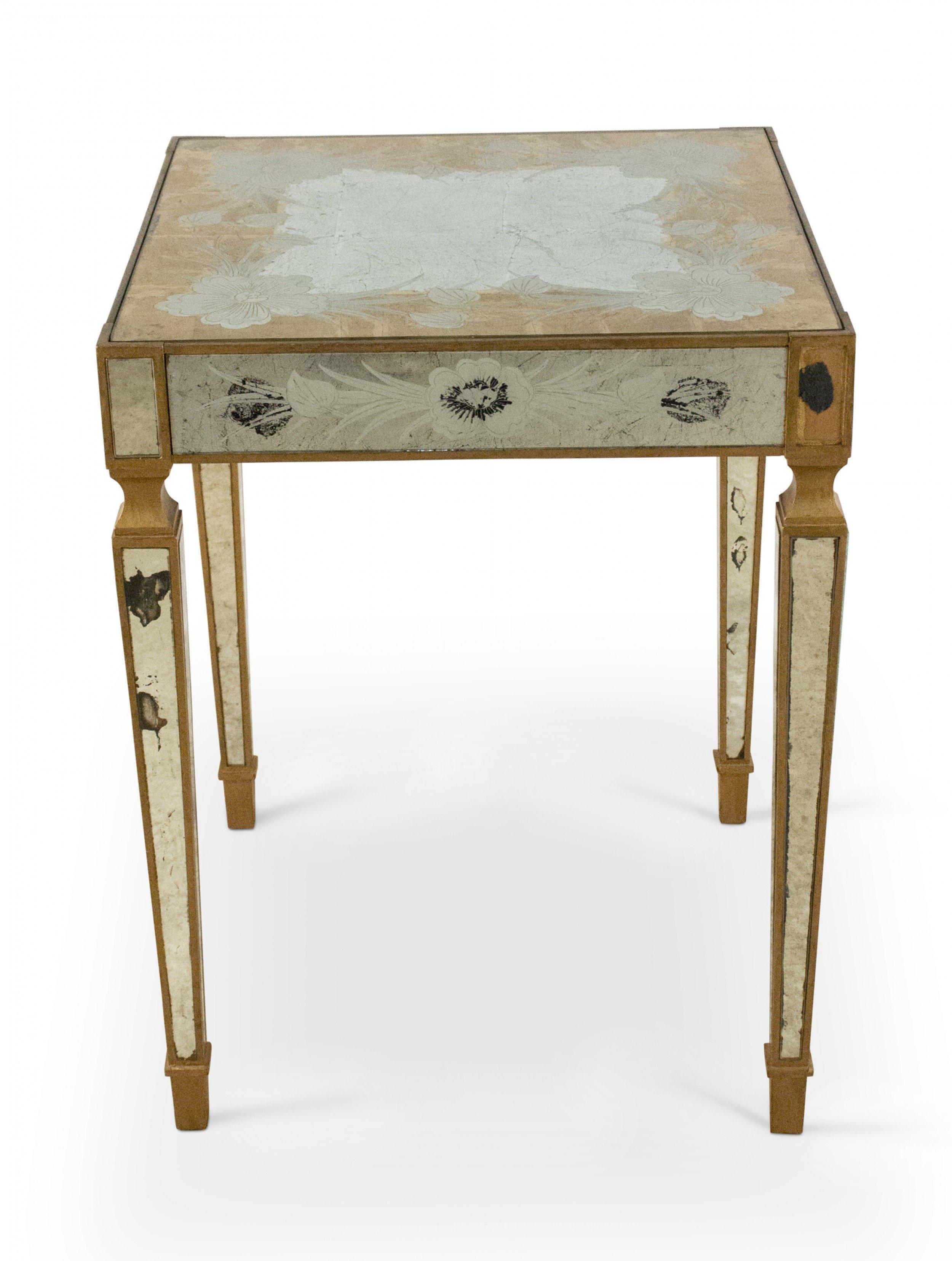 French mid-century square side / end table with églomisé mirrored top and apron with giltwood trim and antique mirrored legs.
