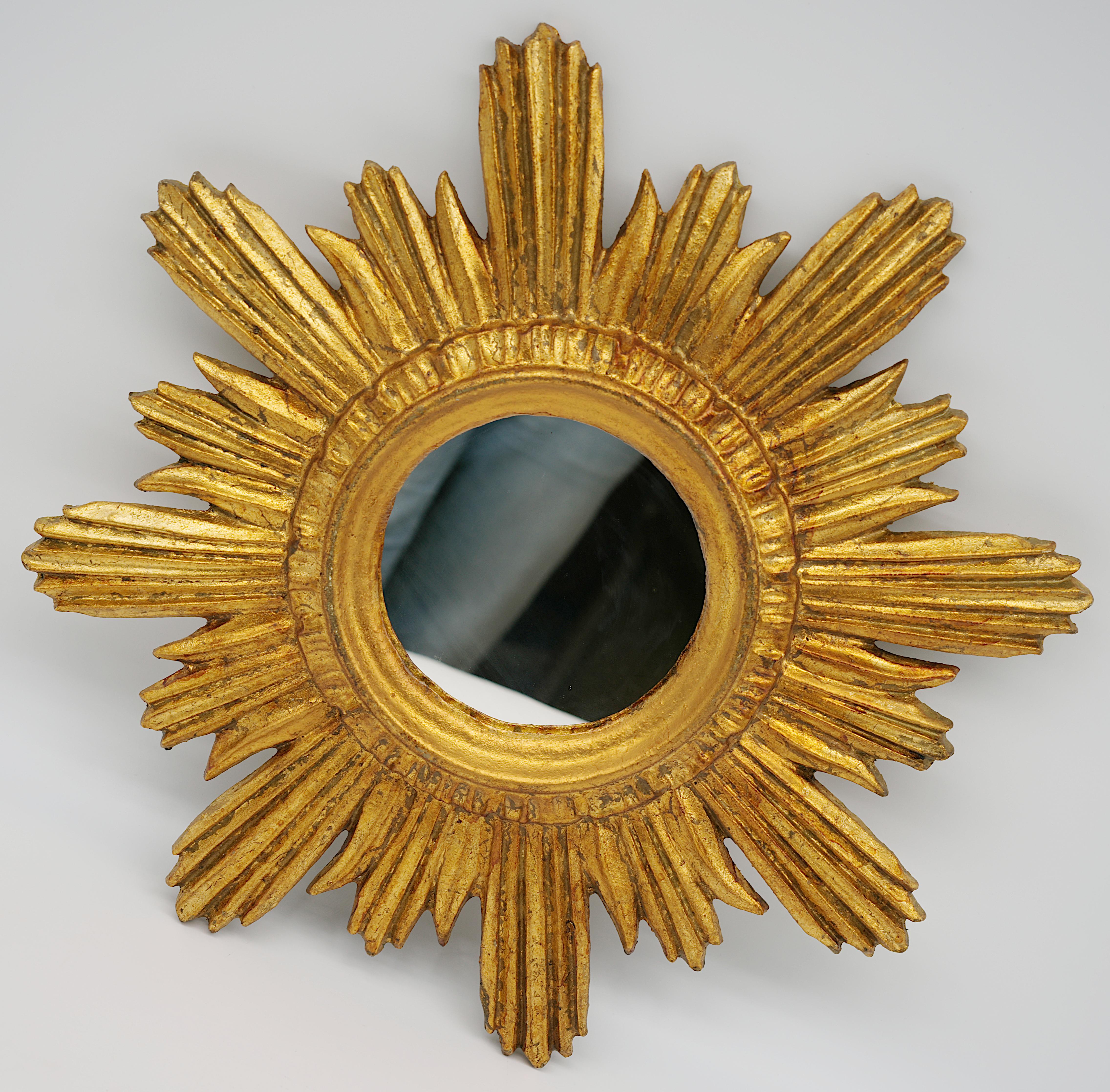 French mid-century wall mirror, France. Genuine from the 1950s. Resin mirror with radiating decoration. Original mirror in very good condition. Measures: Height: 1.2